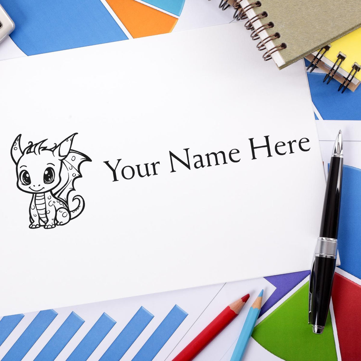 Custom dragon stamp seal with Your Name Here on white paper, surrounded by blue, orange, green, and red stationery.