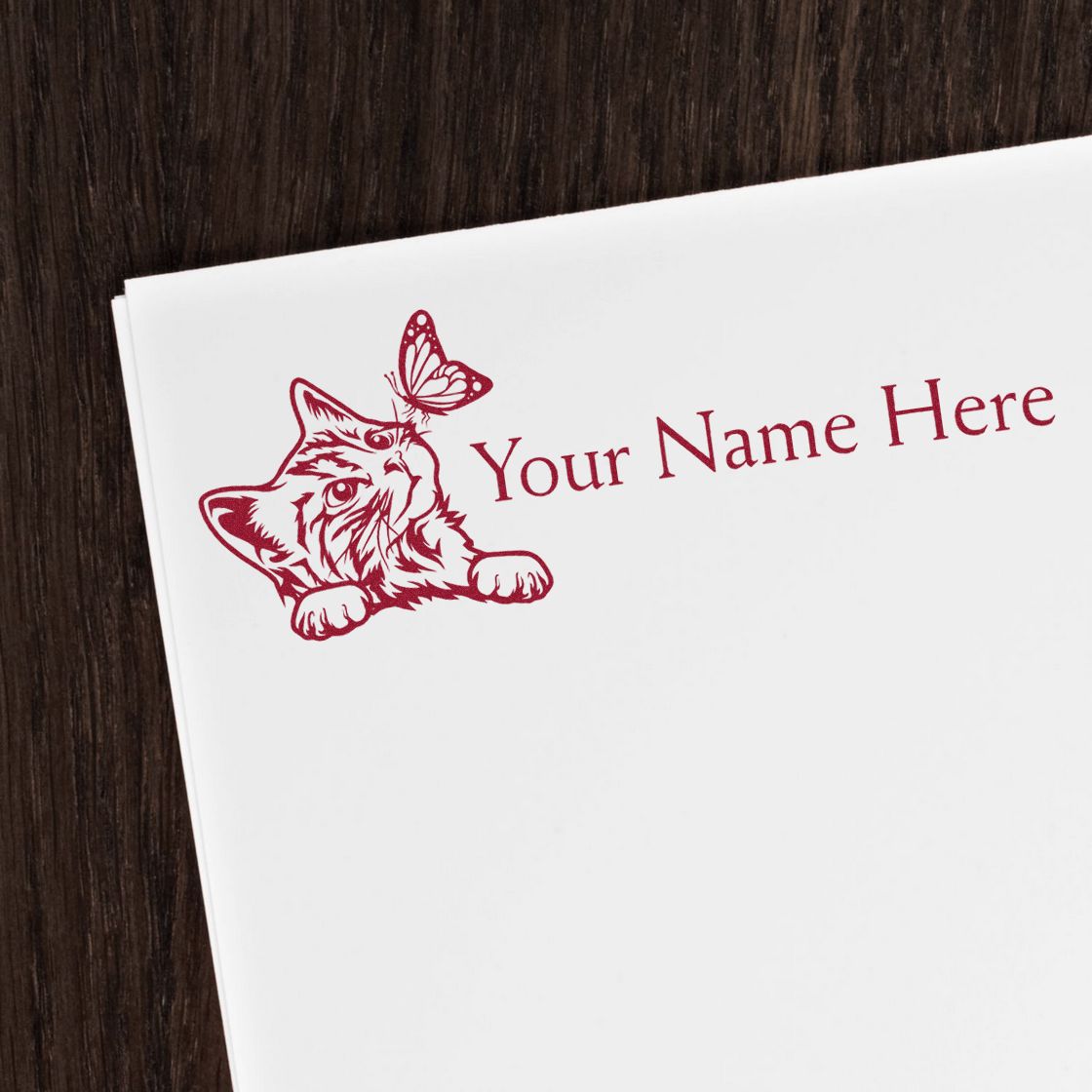 Burgundy custom stamp and seal with cat and butterfly design on white paper, reading Your Name Here.