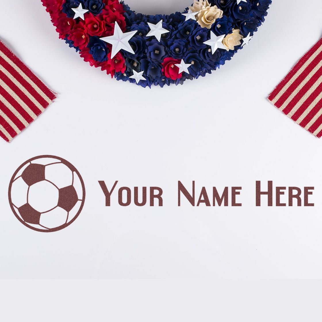 Custom soccer stamp and seal with brown text, red, white and blue floral wreath, and striped ribbon accents.
