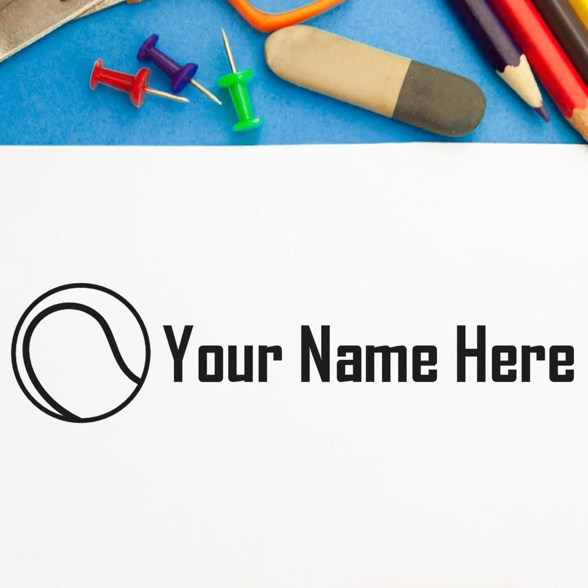 Custom black name stamp and seal with logo on white, framed by colorful push pins, pencils, and blue background.