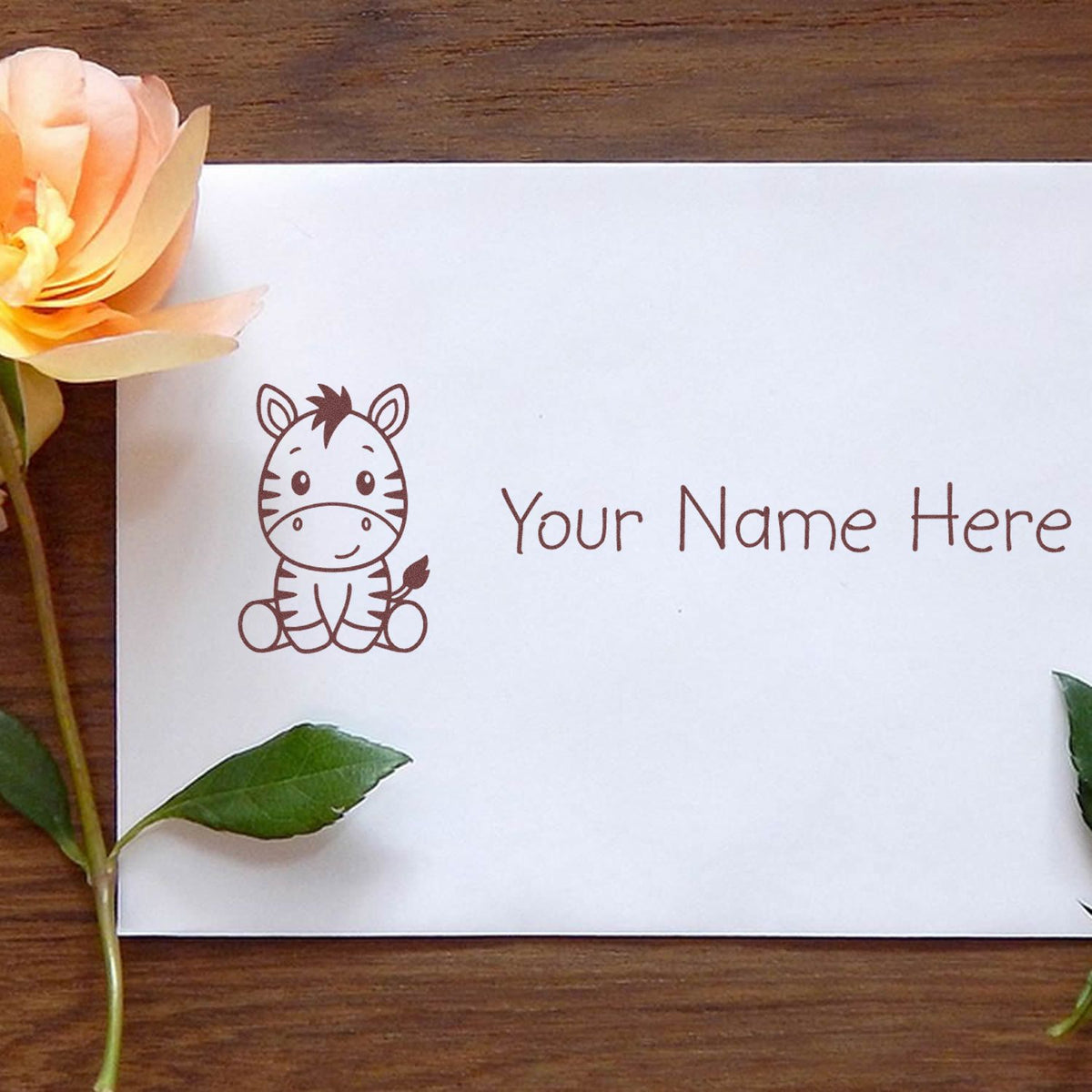 Custom brown zebra stamp and seal on white paper with Your Name Here, accented by peach flower and green leaves.