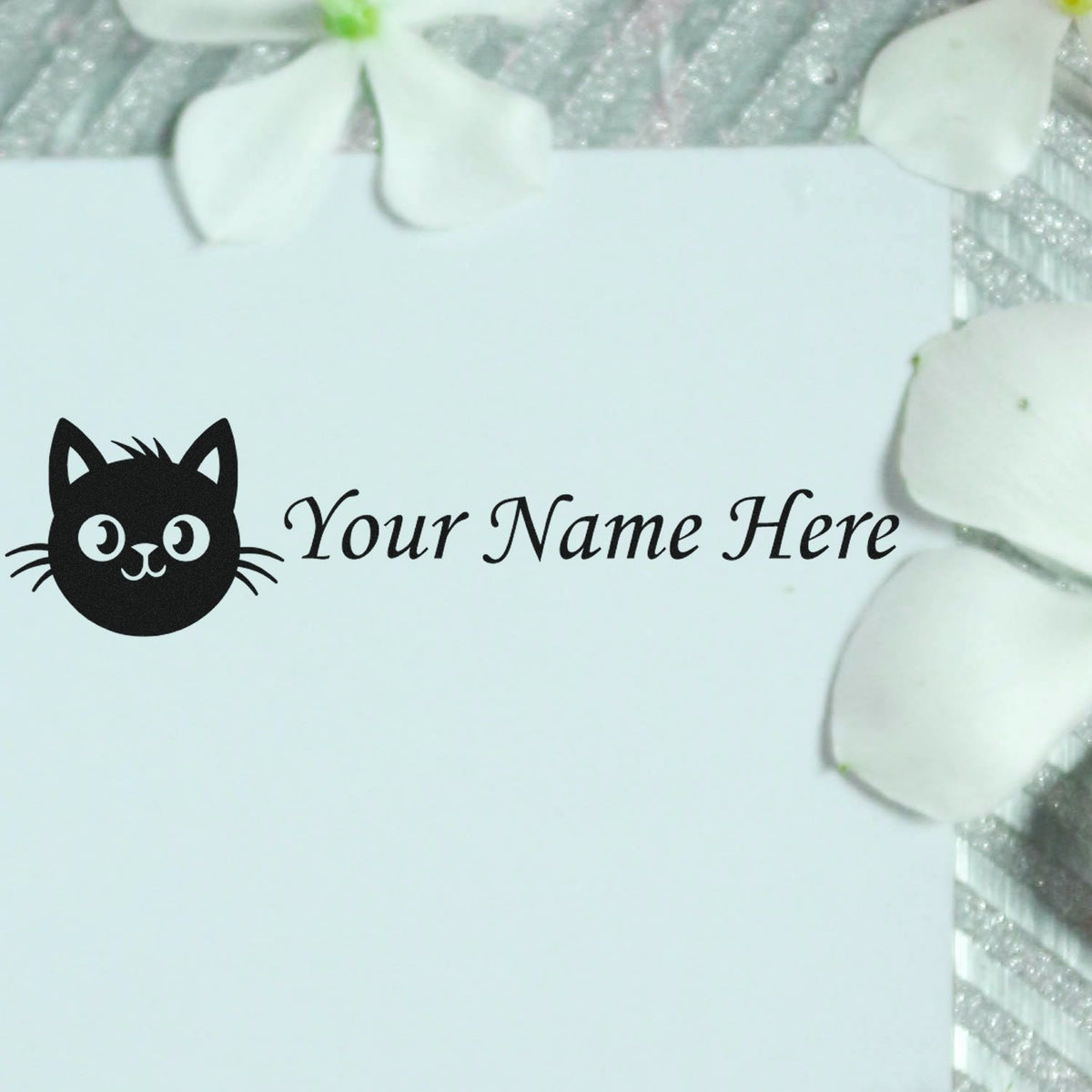 Custom black cat stamp and seal with Your Name Here in black on a white card, surrounded by white petal accents.