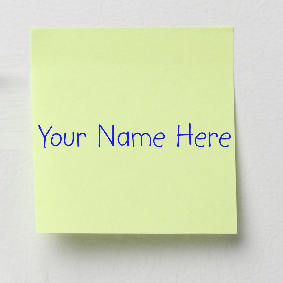 Pale green custom stamp seal pad with blue Your Name Here text on a white background.