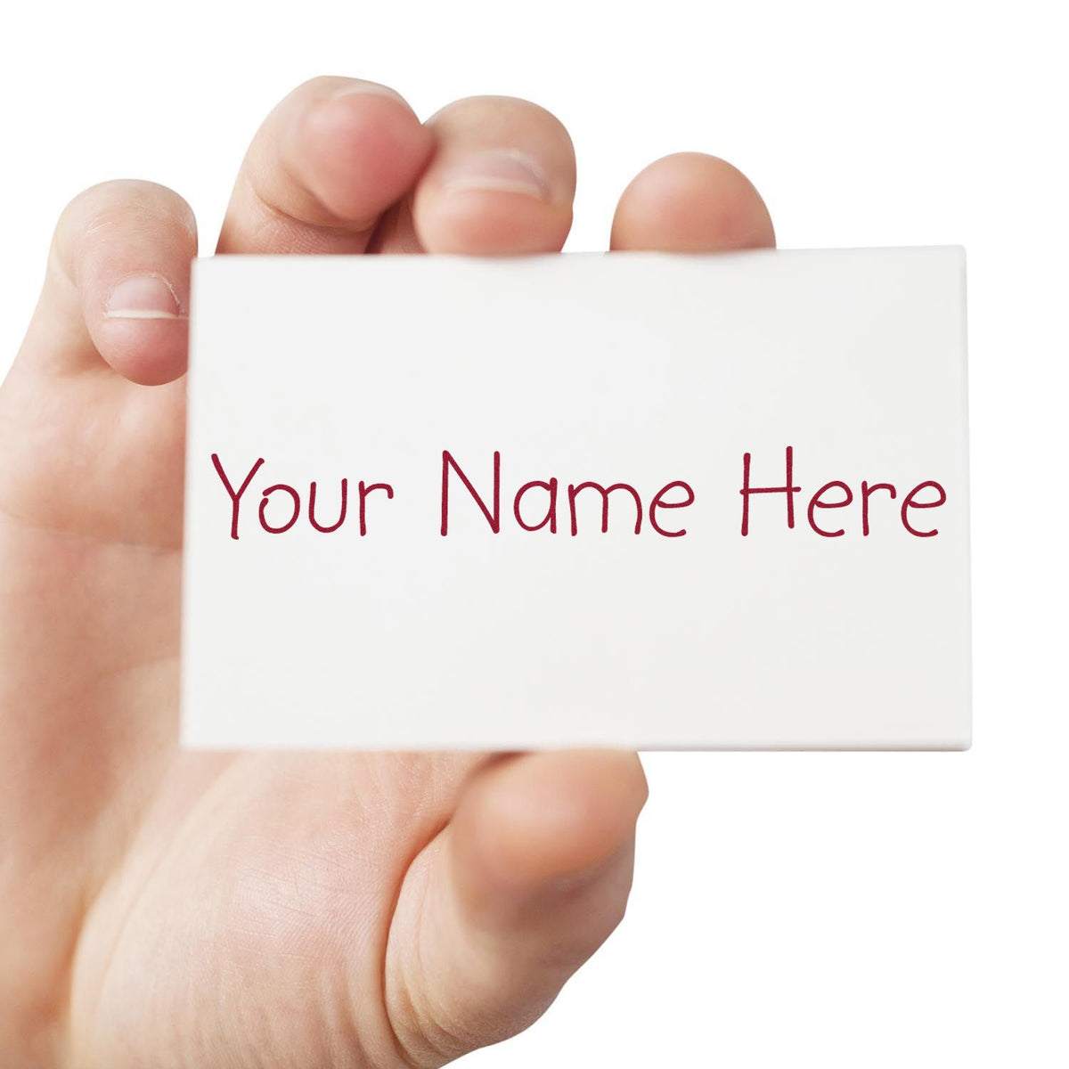 Hand holding white custom stamp seal card with red Your Name Here text on a clean white background.