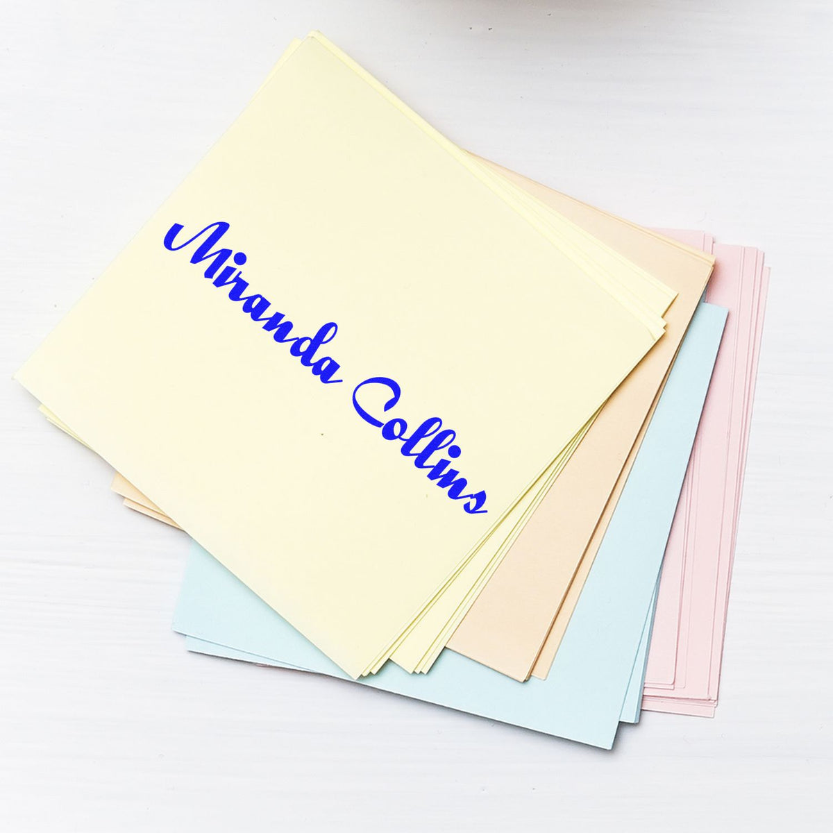 Pastel stamp and seal paper sheets with blue Miranda Collins script on cream, pink, blue, and beige cards.