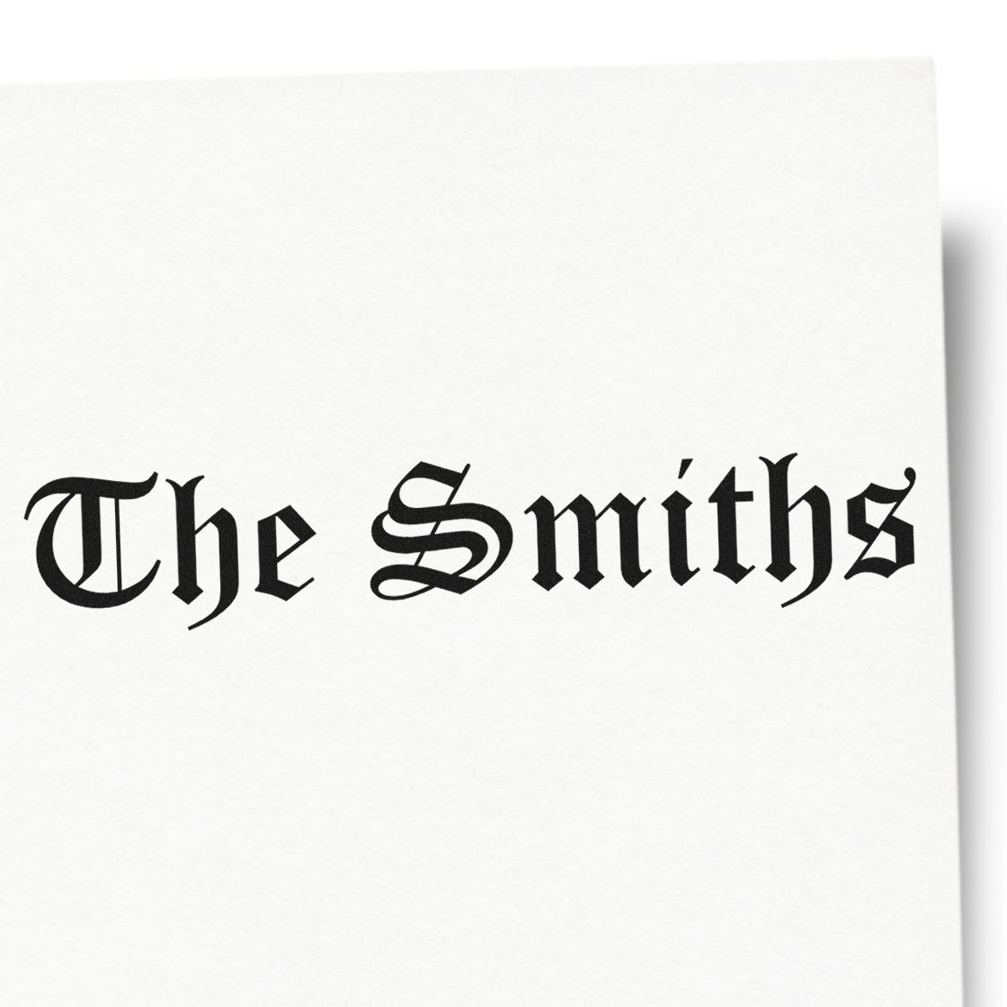 Black Gothic-style stamp and seal reading The Smiths on a clean white background.