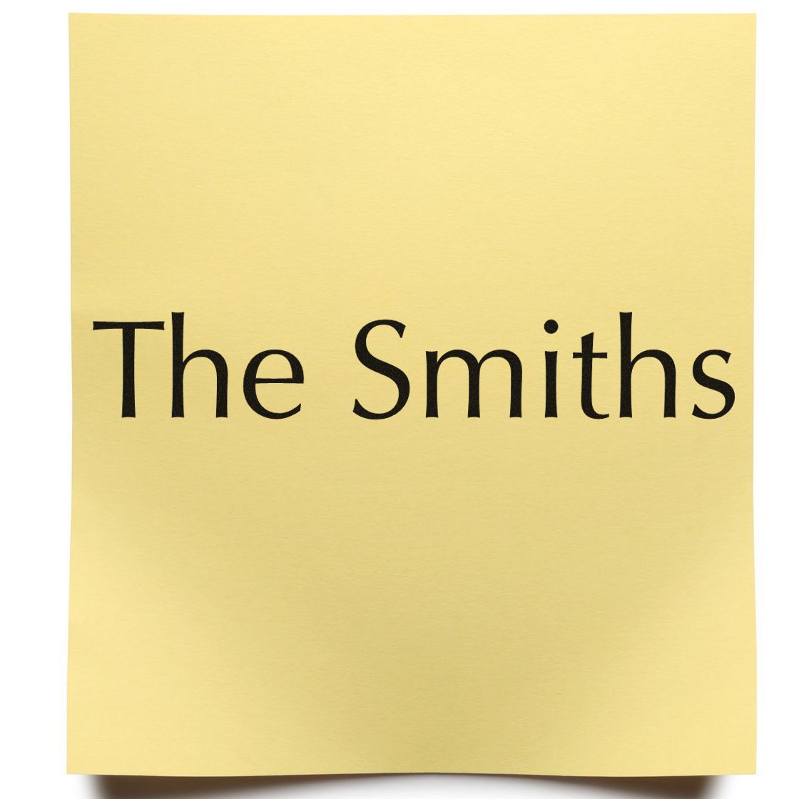 Gold paper stamp seal with black serif text reading The Smiths