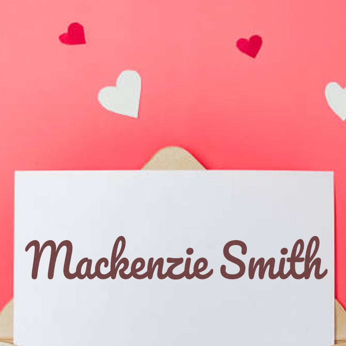 Personalized stamp and seal with Mackenzie Smith on white card, pink background, red and white heart accents