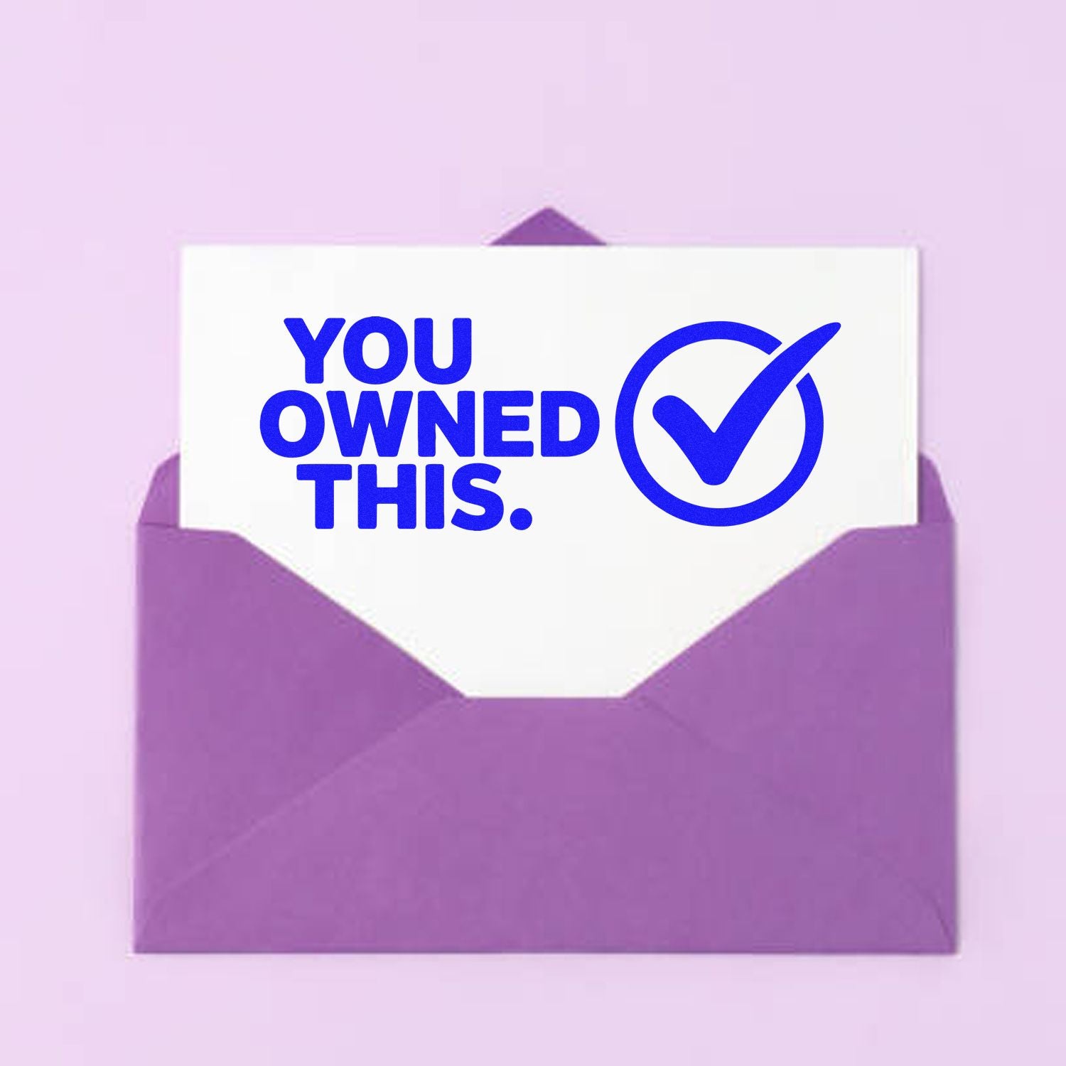 Purple envelope with white stamp reading YOU OWNED THIS. and blue checkmark seal on a pastel lavender background.
