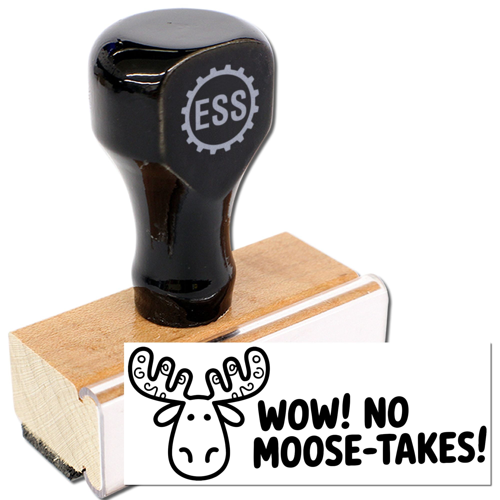 Black rubber stamp seal on a wooden block with ESS logo, showing a moose-themed imprint reading WOW! NO MOOSE-TAKES!