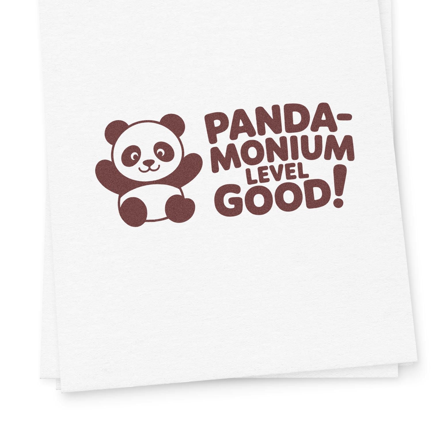 Brown panda rubber stamp and seal design with PANDA-MONIUM LEVEL GOOD! on white paper