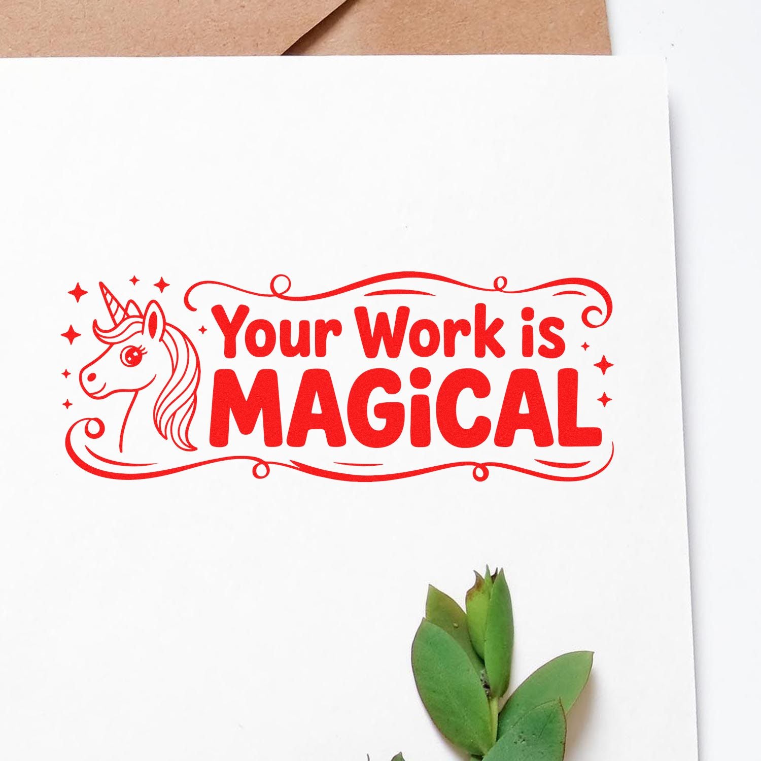 Red unicorn stamp seal with Your Work is Magical in bold red on white paper