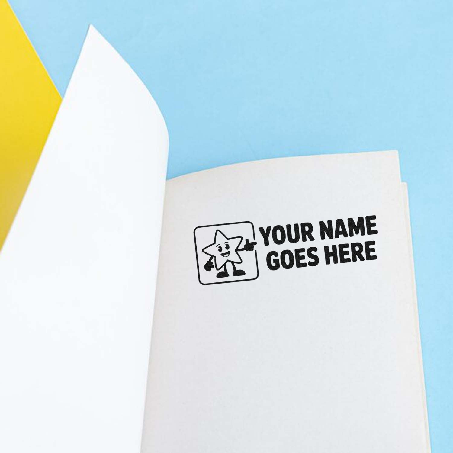 Custom black stamp and seal reading Your Name Goes Here on white paper, with light blue and yellow background.