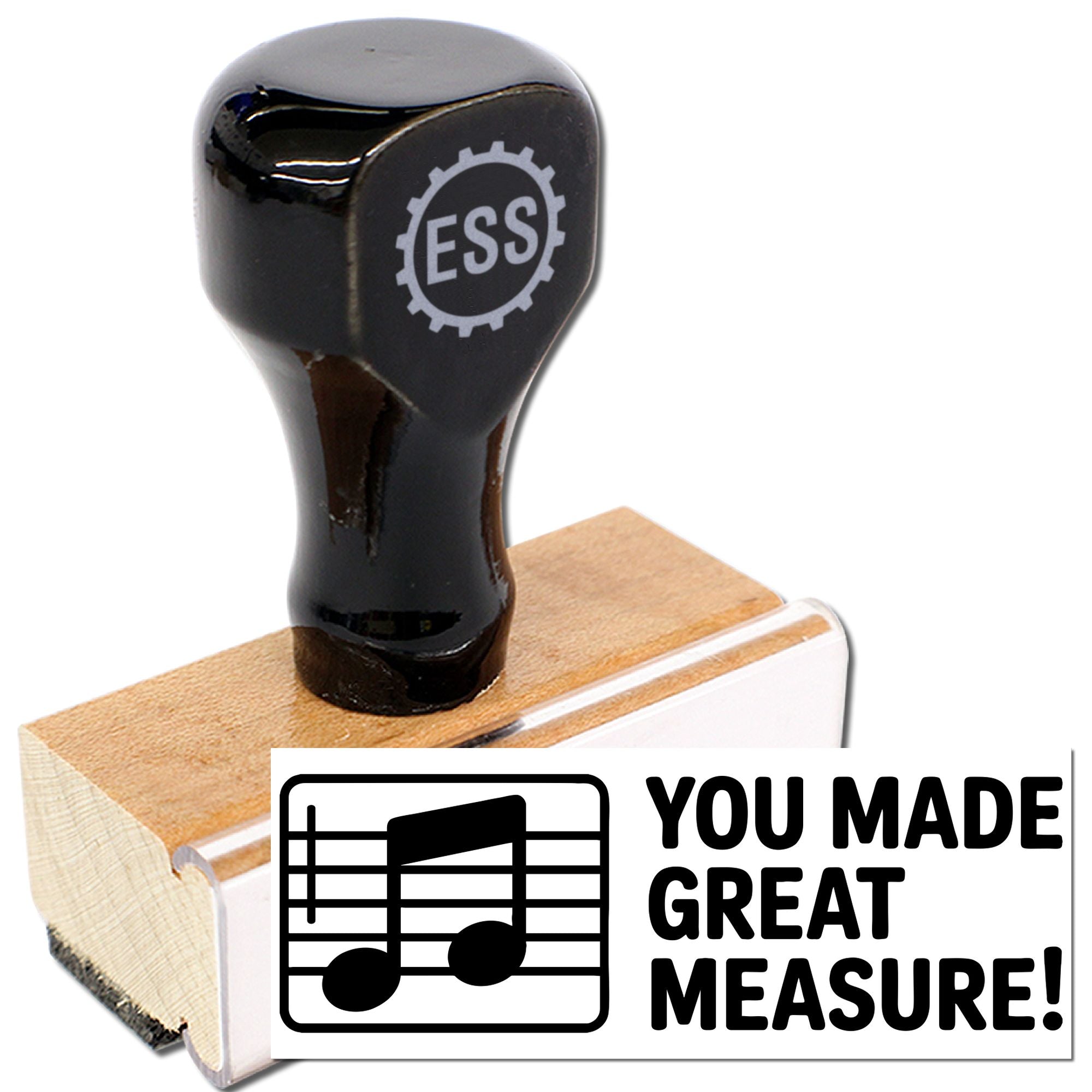 Black ESS stamp seal on a wooden base with music notes and You Made Great Measure! text