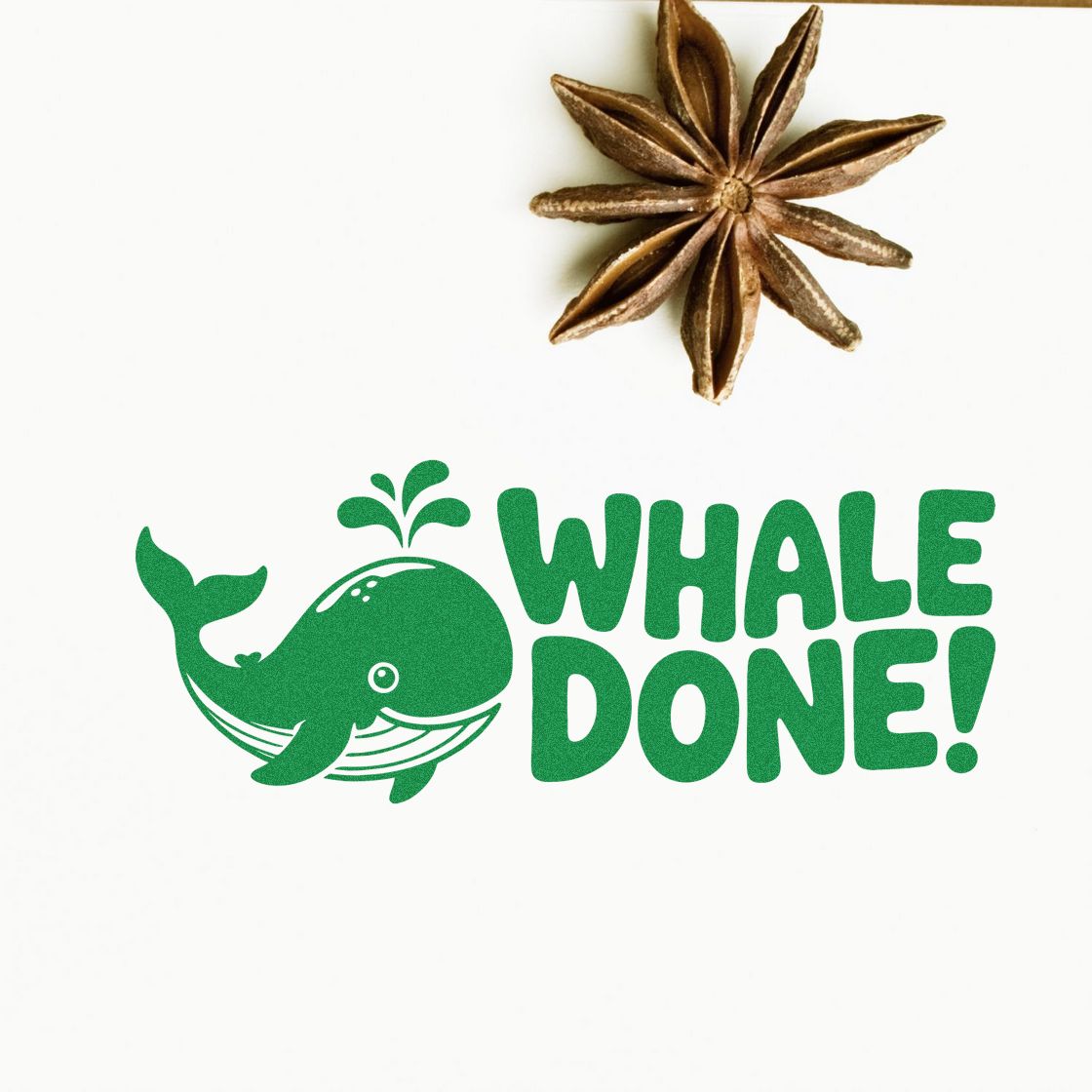 Green whale WHALE DONE! stamp and brown star anise seal on a white background.