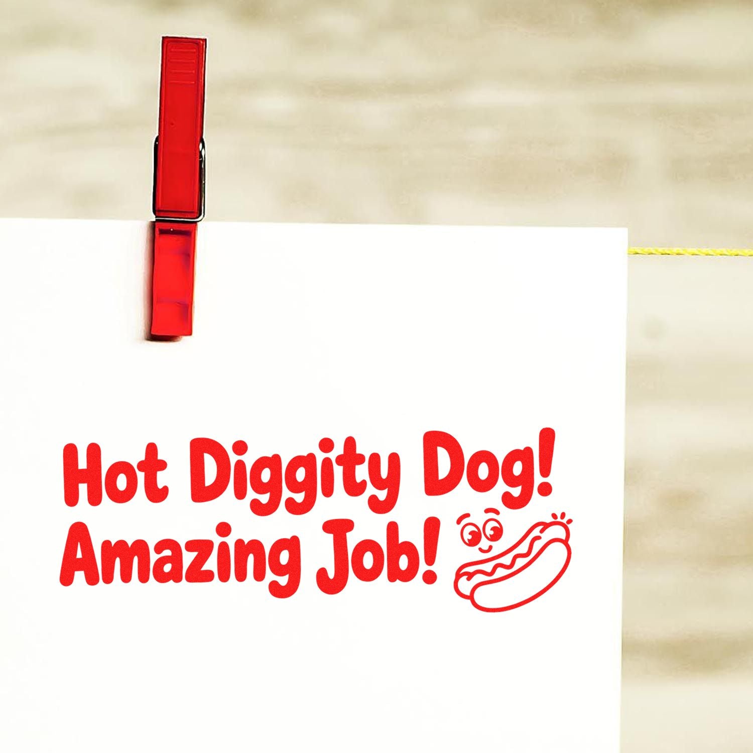Red stamp and seal on white paper with Hot Diggity Dog! Amazing Job! and a hot dog icon.