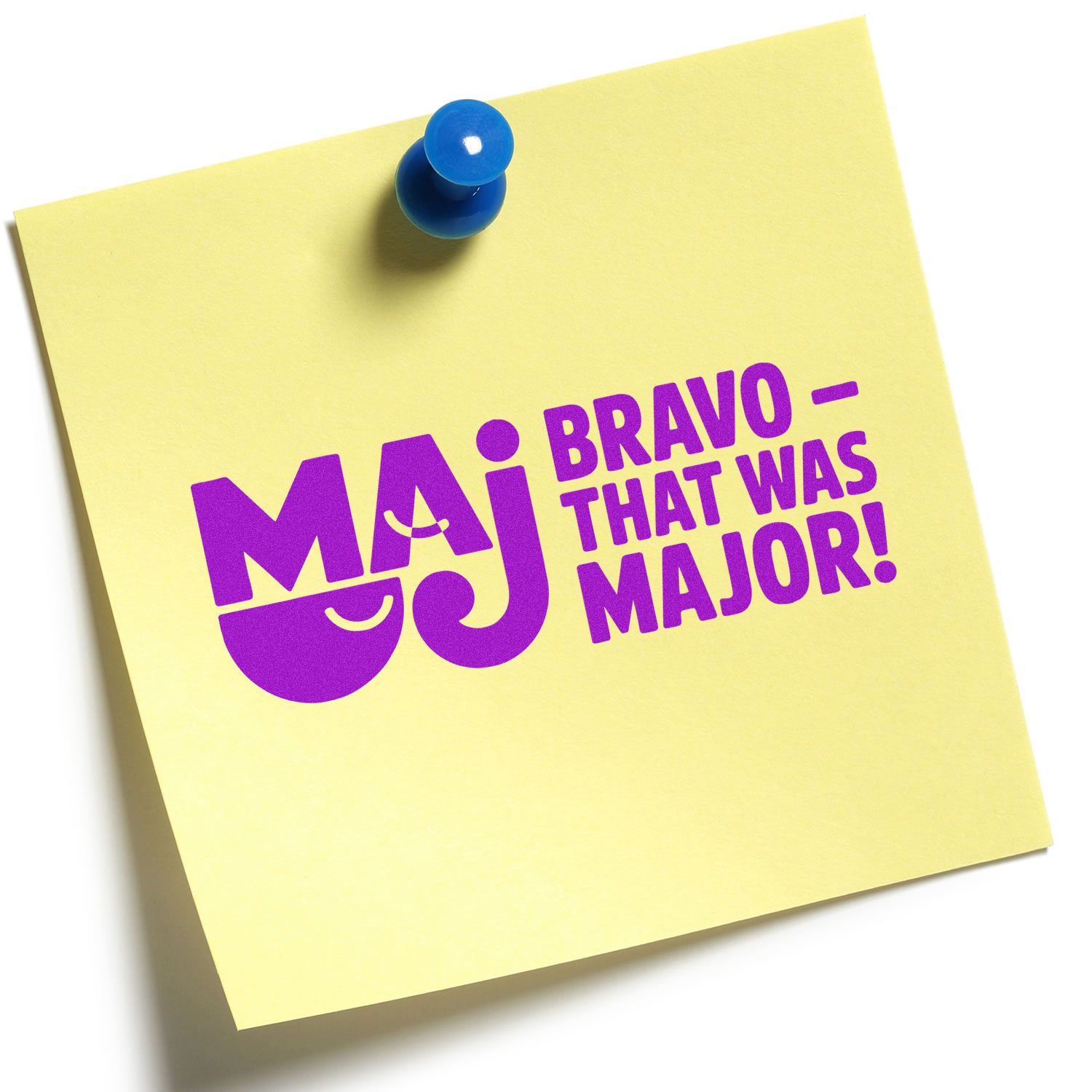 Yellow sticky note with blue pushpin and purple MAJ stamp/seal reading Bravothat was major!