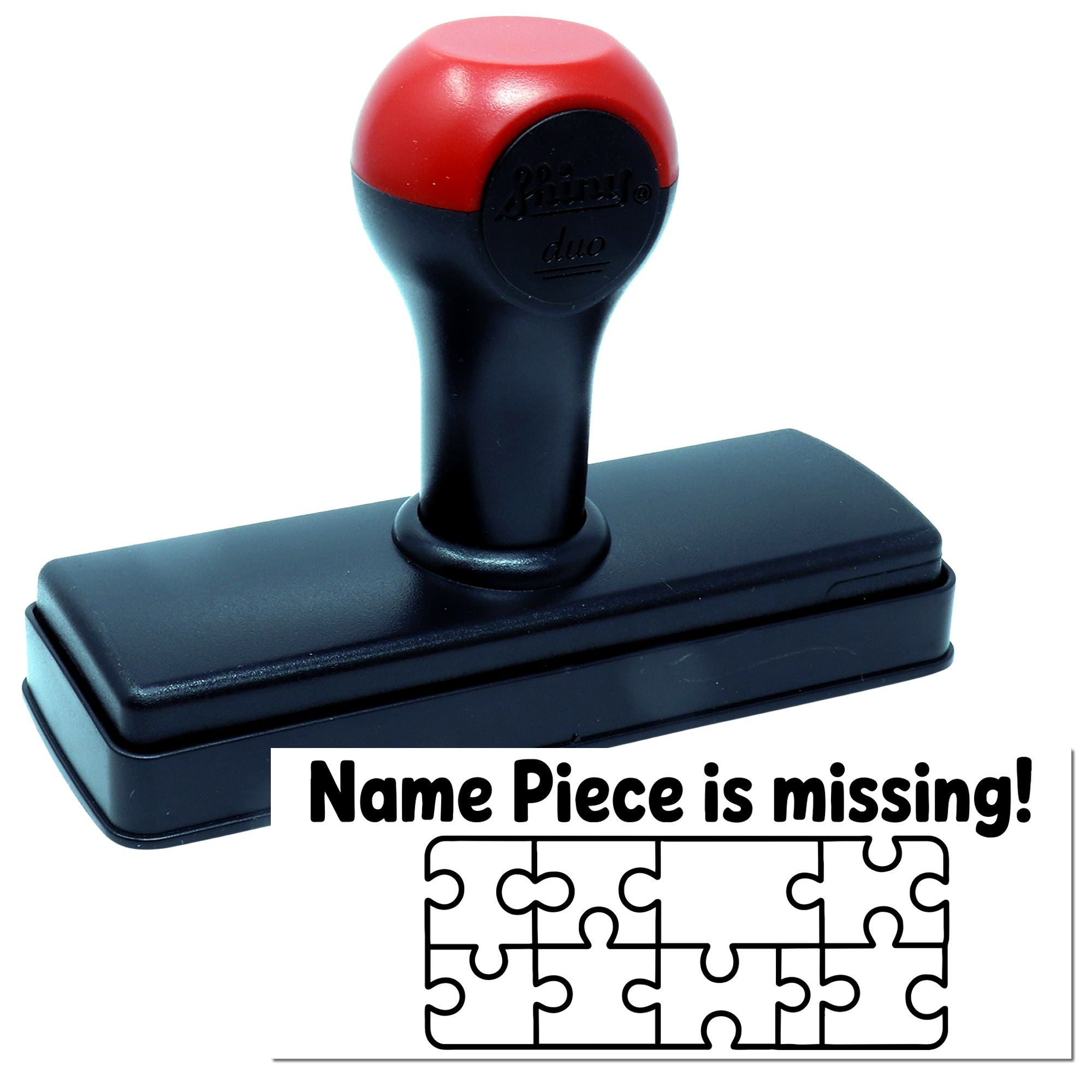 Red-and-black self-inking stamp and seal with rectangular black base and Name Piece is missing! puzzle graphic below.