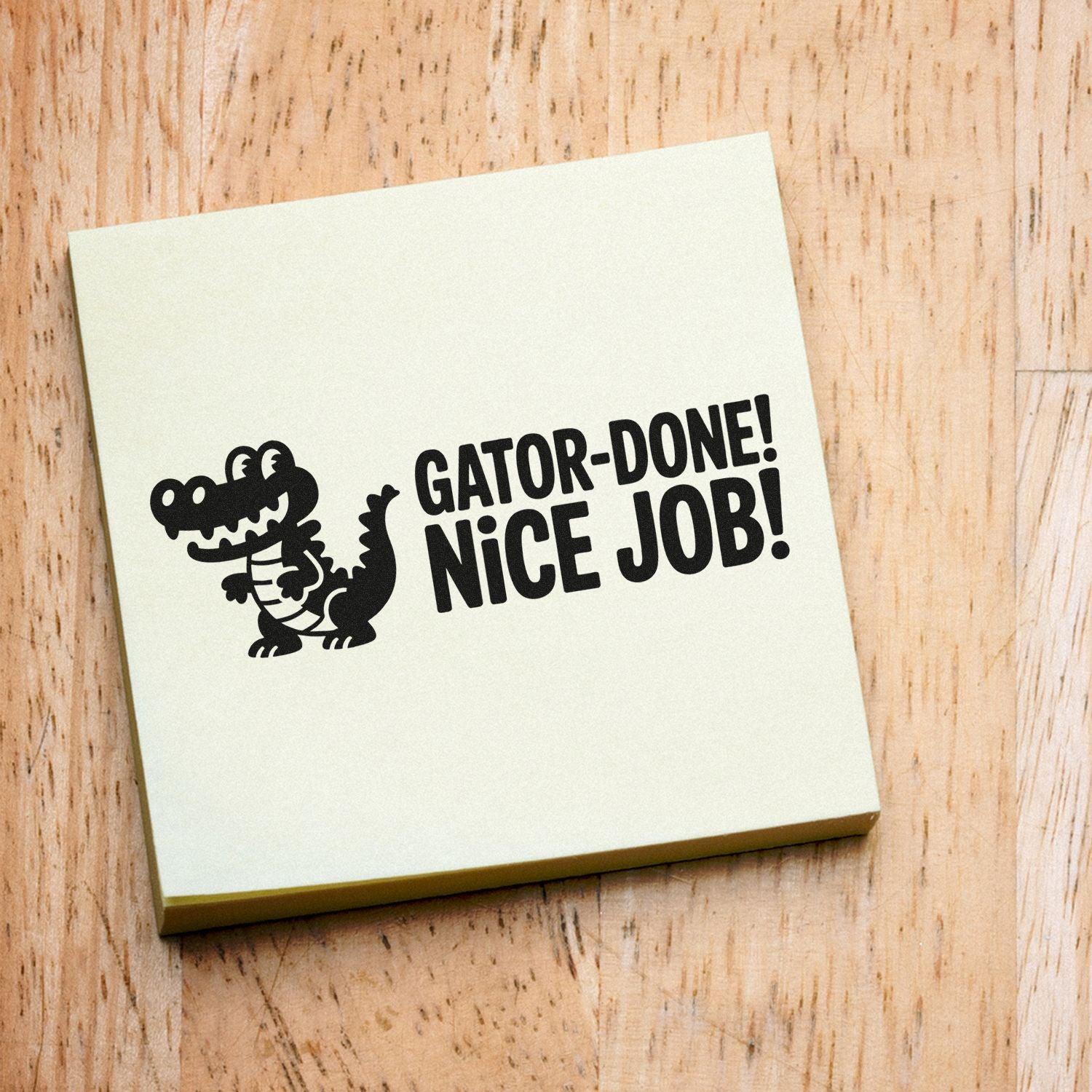 Cream stamp and seal product featuring a black alligator and GATOR-DONE! NICE JOB! on wood background.