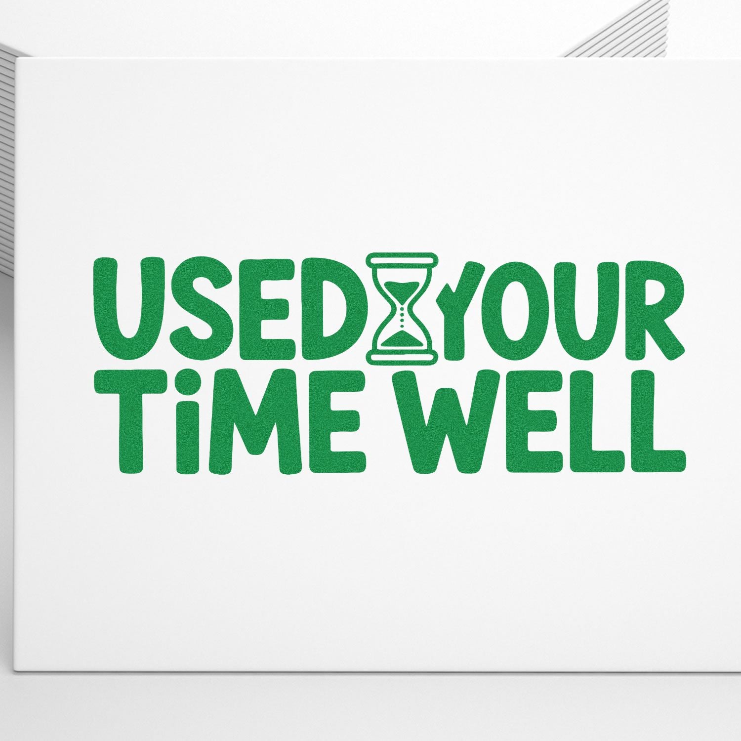 Green rubber stamp seal reading USED YOUR TIME WELL with hourglass icon on a white background.