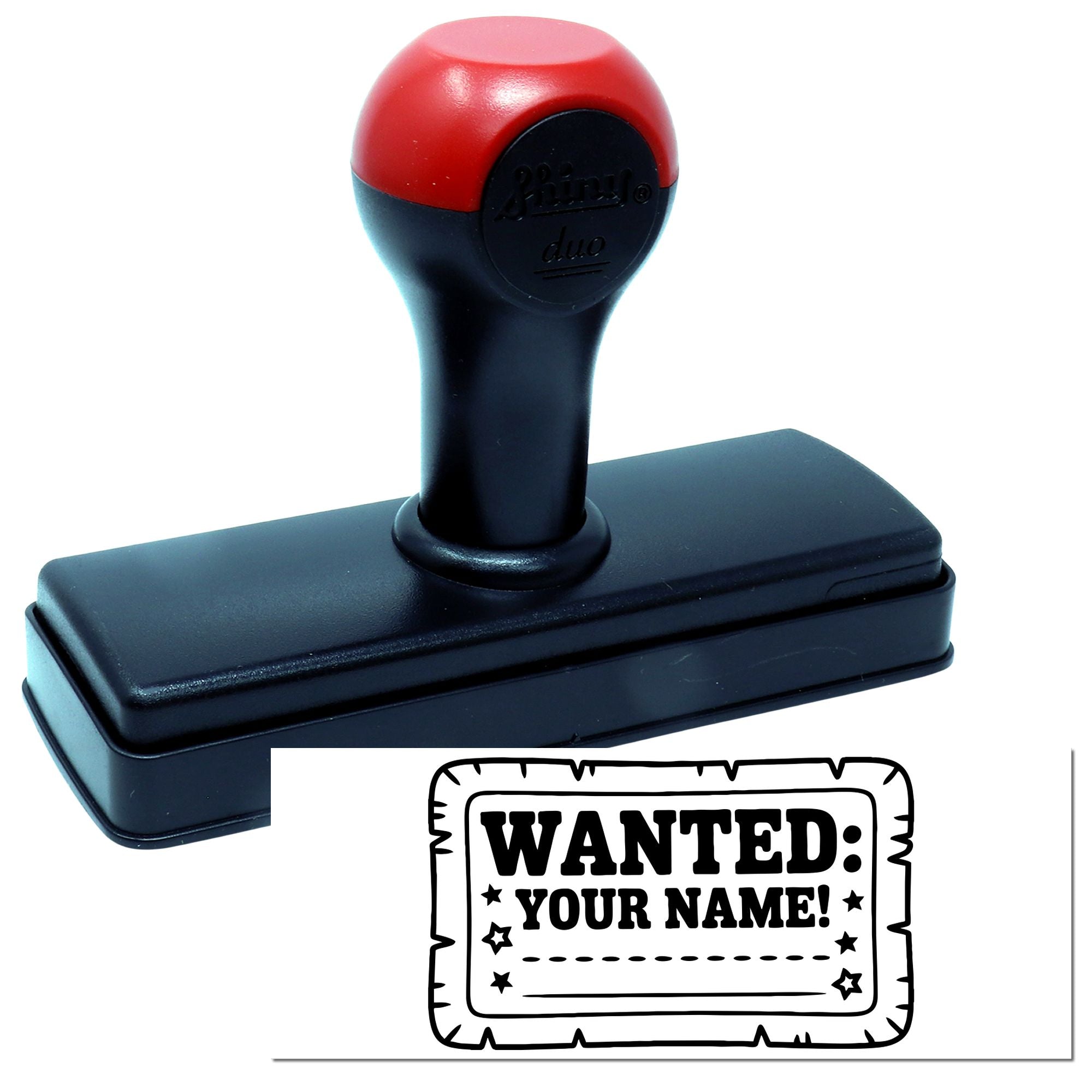 Red-and-black self-inking stamp with black base and custom seal reading WANTED: YOUR NAME!