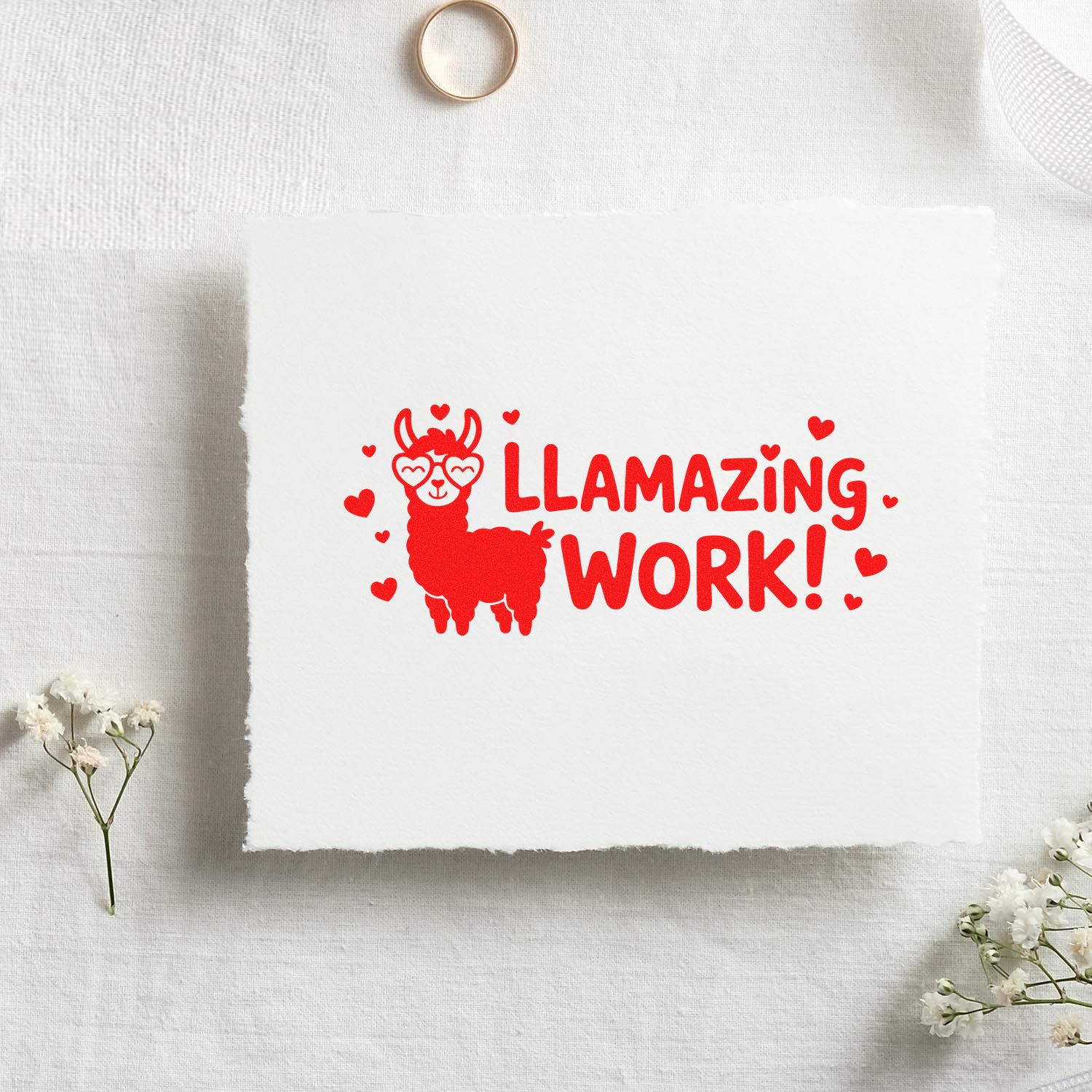 Red llama stamp seal design with hearts and LLAMAZING WORK! on white paper swatch