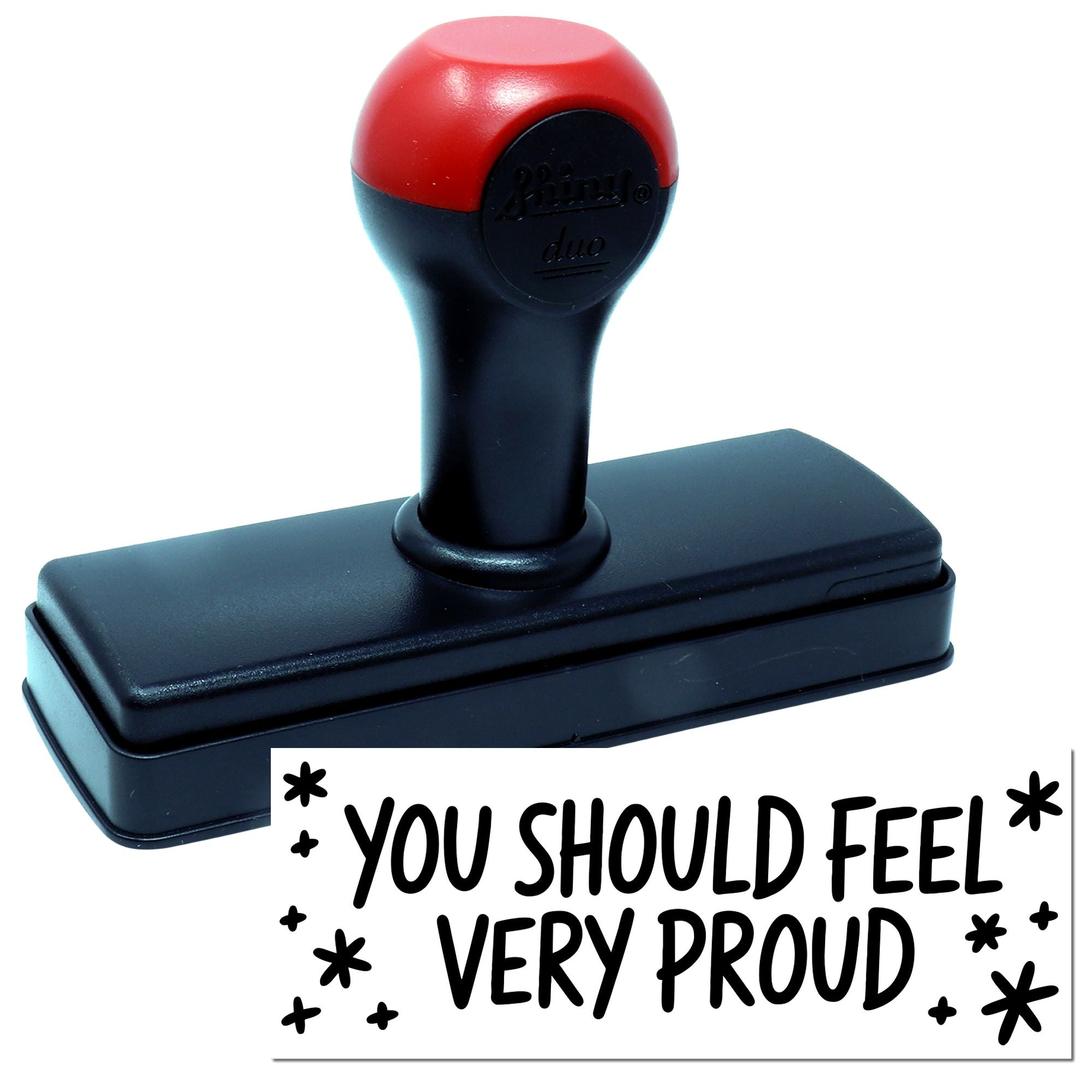Red and black self-inking stamp and seal with rectangular base, imprinting YOU SHOULD FEEL VERY PROUD with stars.