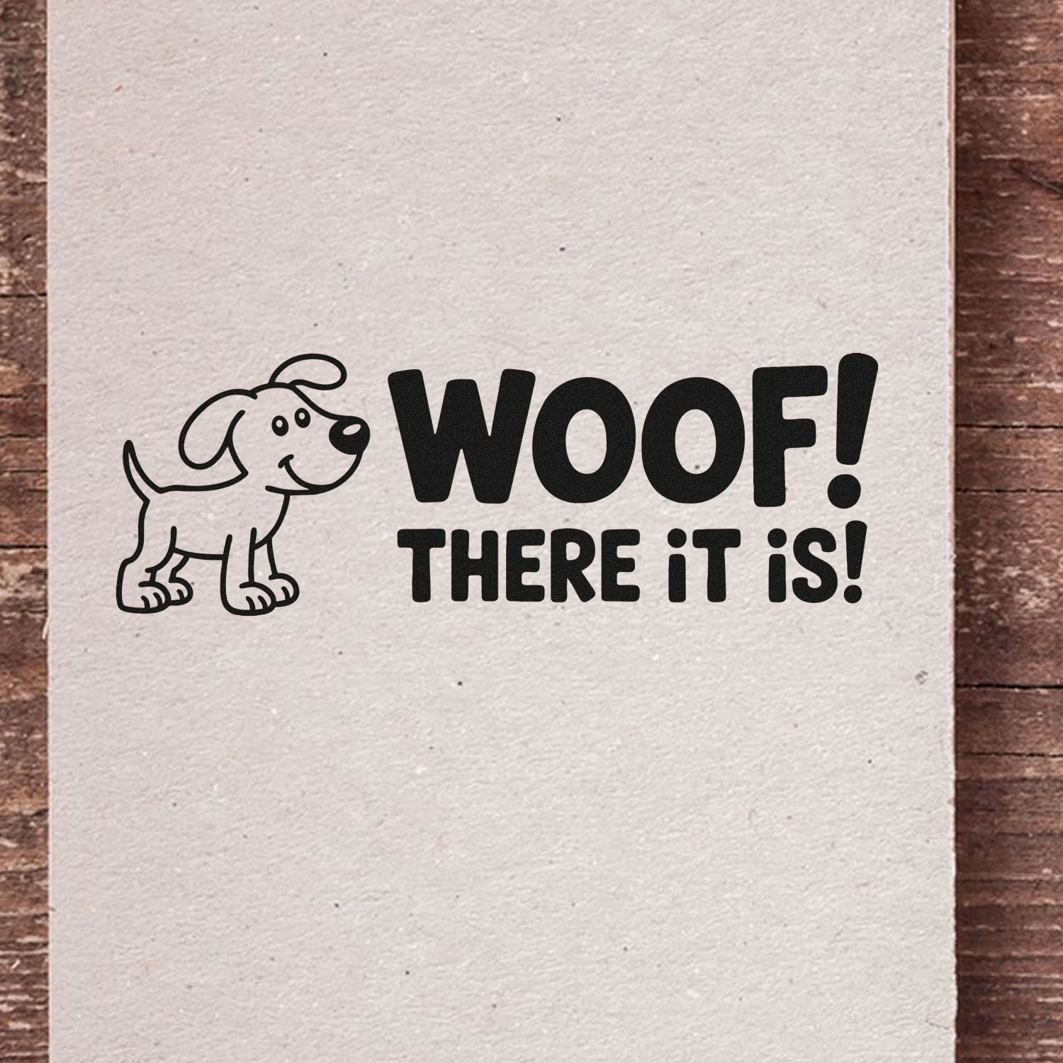Black dog stamp seal with bold WOOF! THERE IT IS! text on cream paper, playful black-and-white pet design.