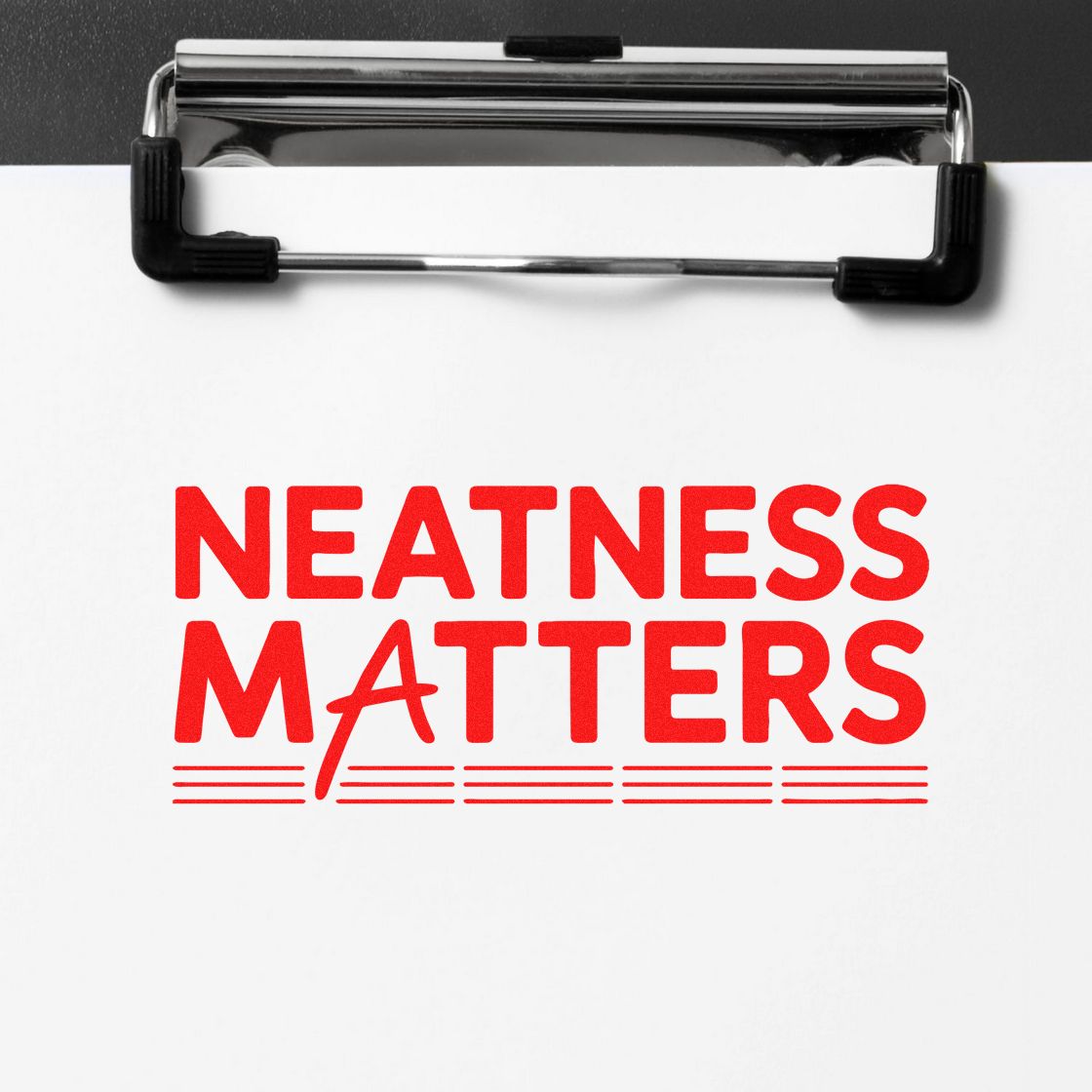 Red Neatness Matters stamp and seal on white paper, clipped by a black metal clipboard.