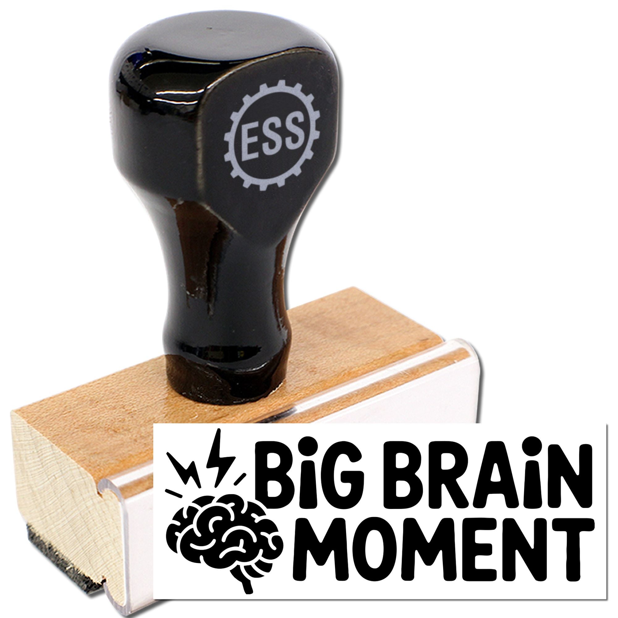 Black rubber stamp with wooden base, ESS gear logo, and bold Big Brain Moment seal on white background.