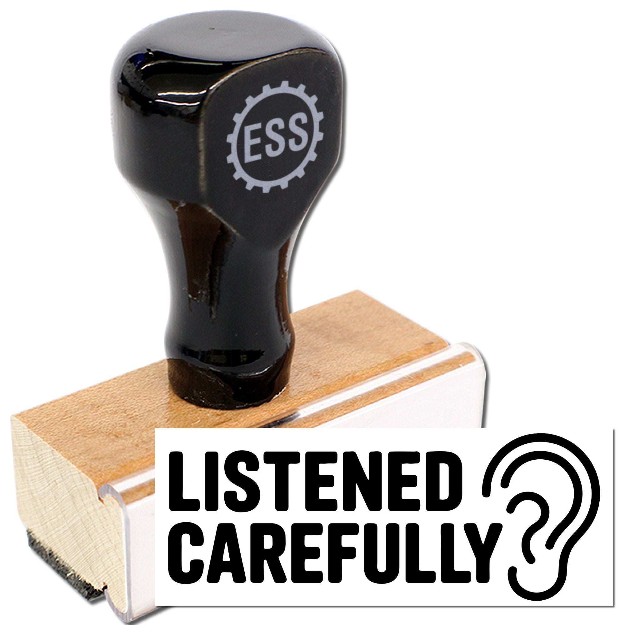Black ESS self-inking stamp on a wooden base with a white seal label reading LISTENED CAREFULLY?