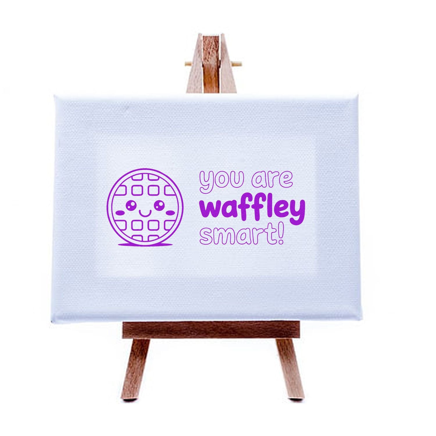 Purple waffle-themed stamp and seal design on a white canvas easel, with smiling waffle icon and you are waffley smart! text.