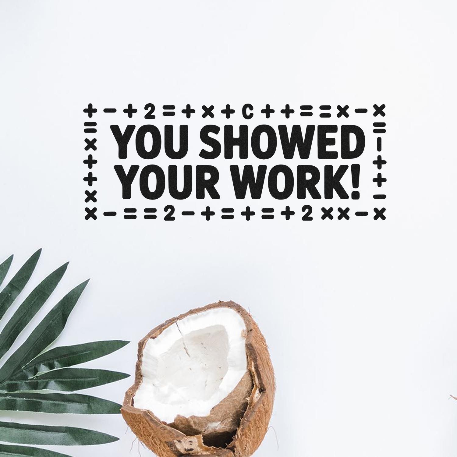 Black rubber stamp and seal reading YOU SHOWED YOUR WORK! with math-symbol border on a white background.