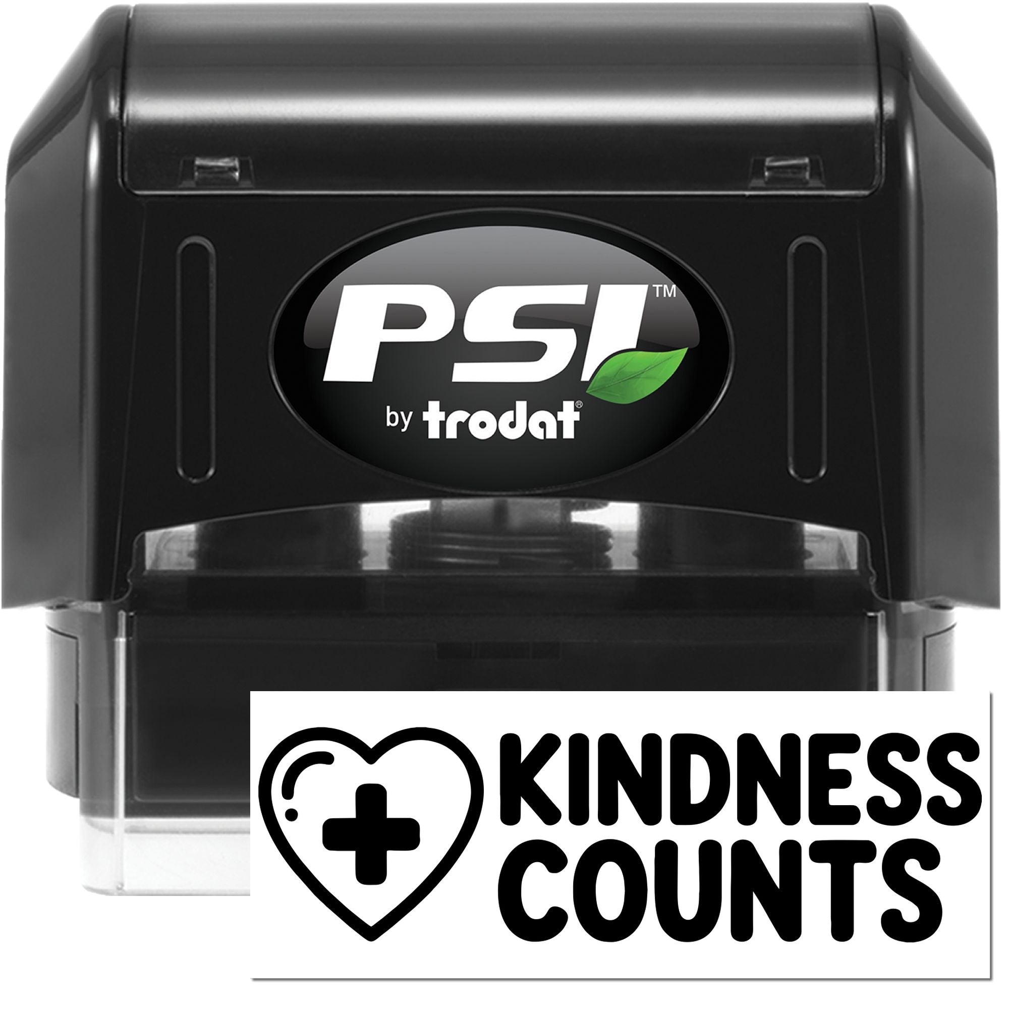 Black PSI by Trodat self-inking stamp and seal with Kindness Counts heart-plus imprint on white background.
