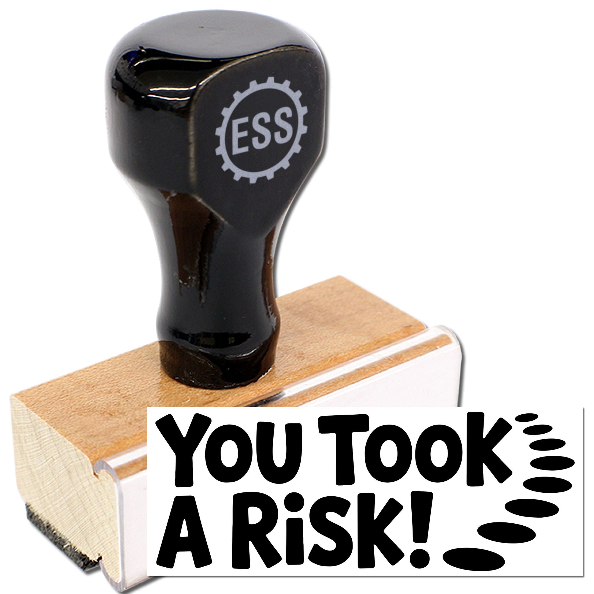 Black ESS stamp and seal on a wooden handle with white base, featuring bold You Took A Risk! text.