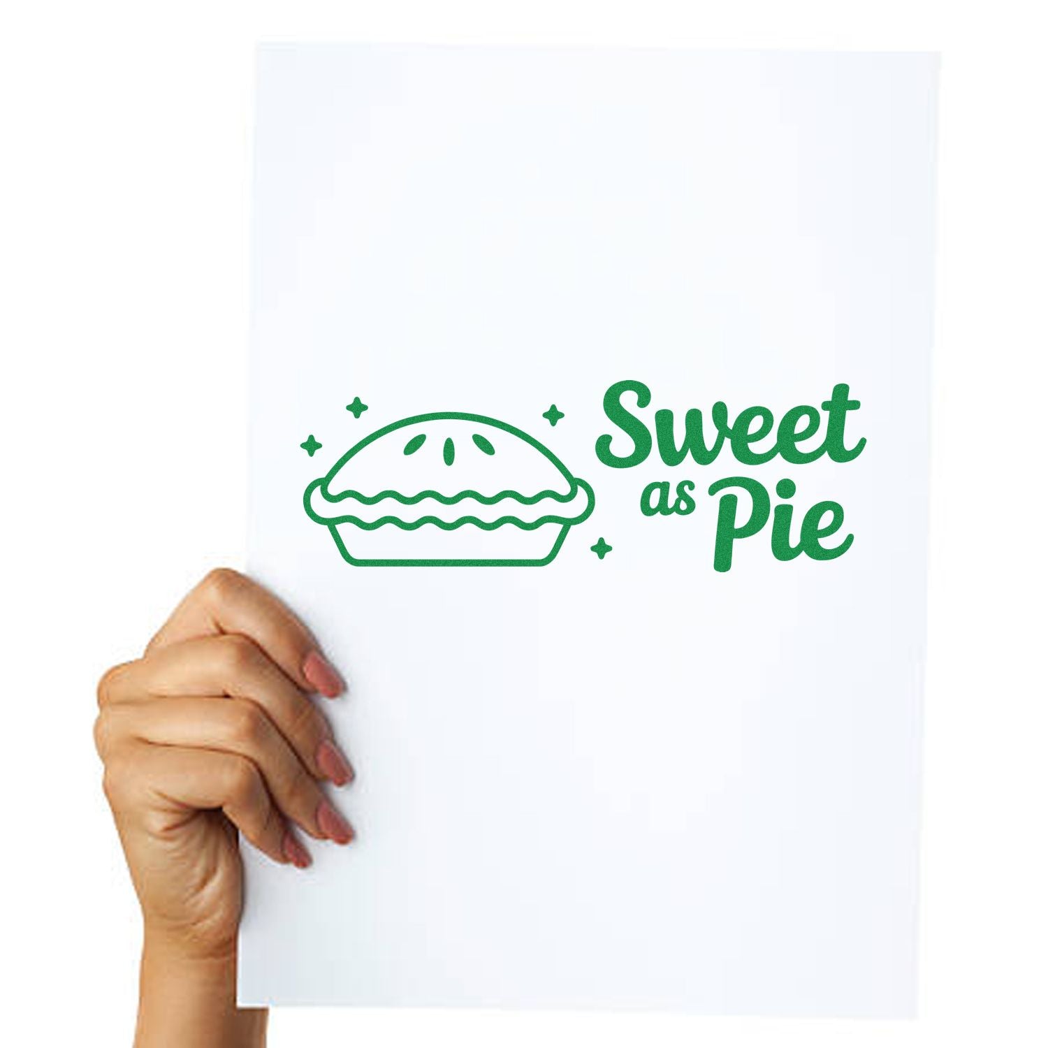Green Sweet as Pie stamp and seal design with pie icon and stars on a white sheet held by a hand.