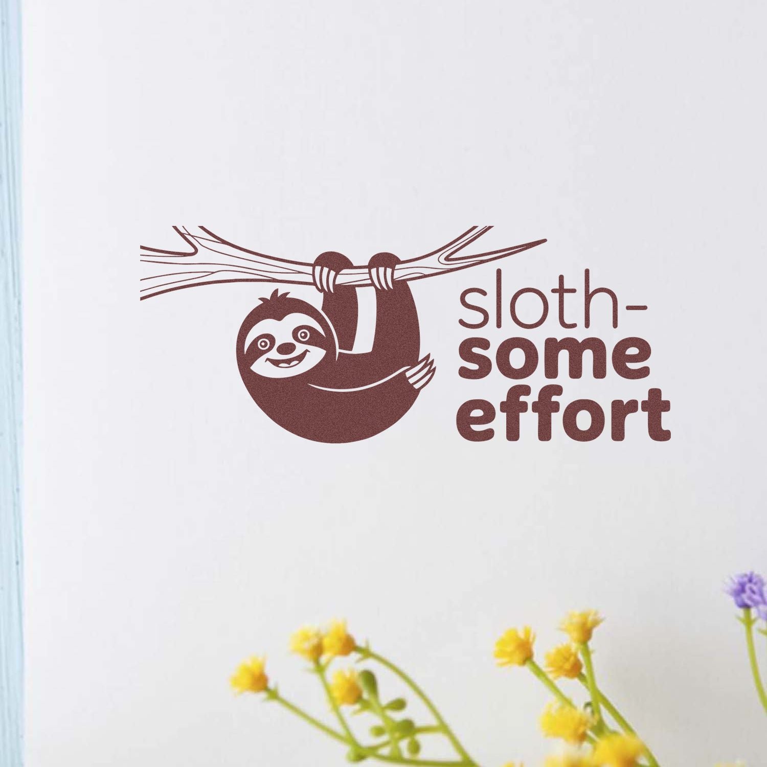 Brown sloth hanging from a branch with sloth-some effort text, a stamp and seal design on a white background.