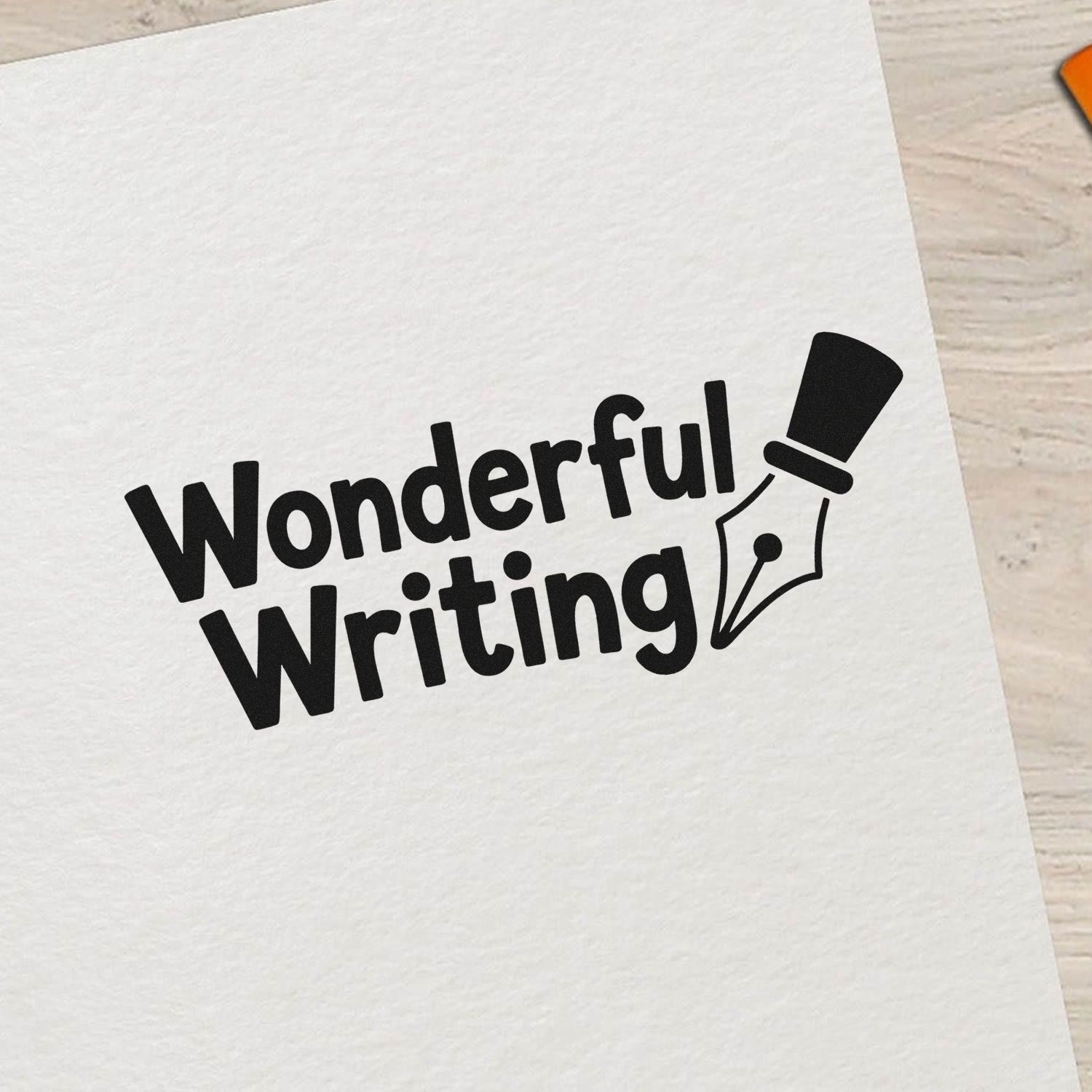 Black Wonderful Writing stamp seal with fountain pen nib on white textured paper.