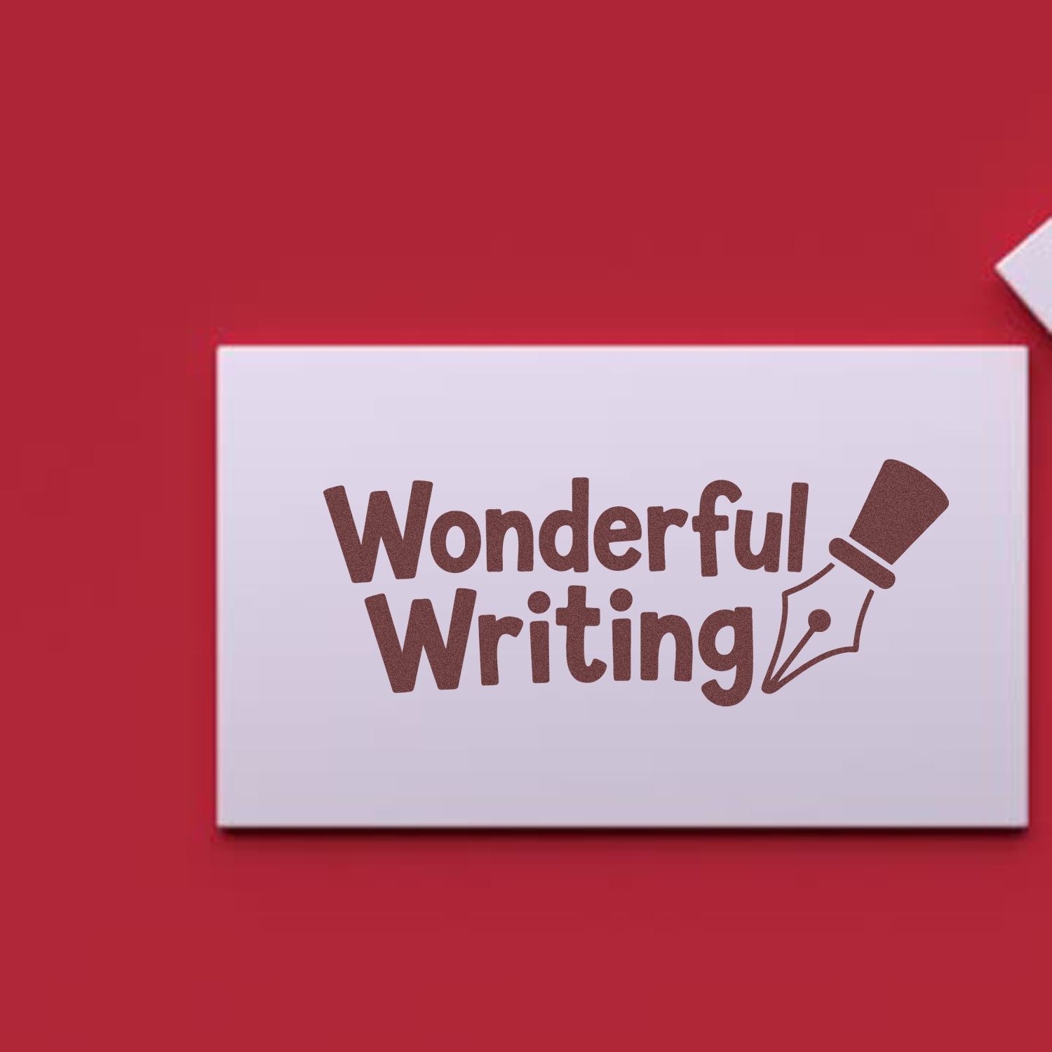White stamp card with brown Wonderful Writing seal and fountain pen nib on a red background