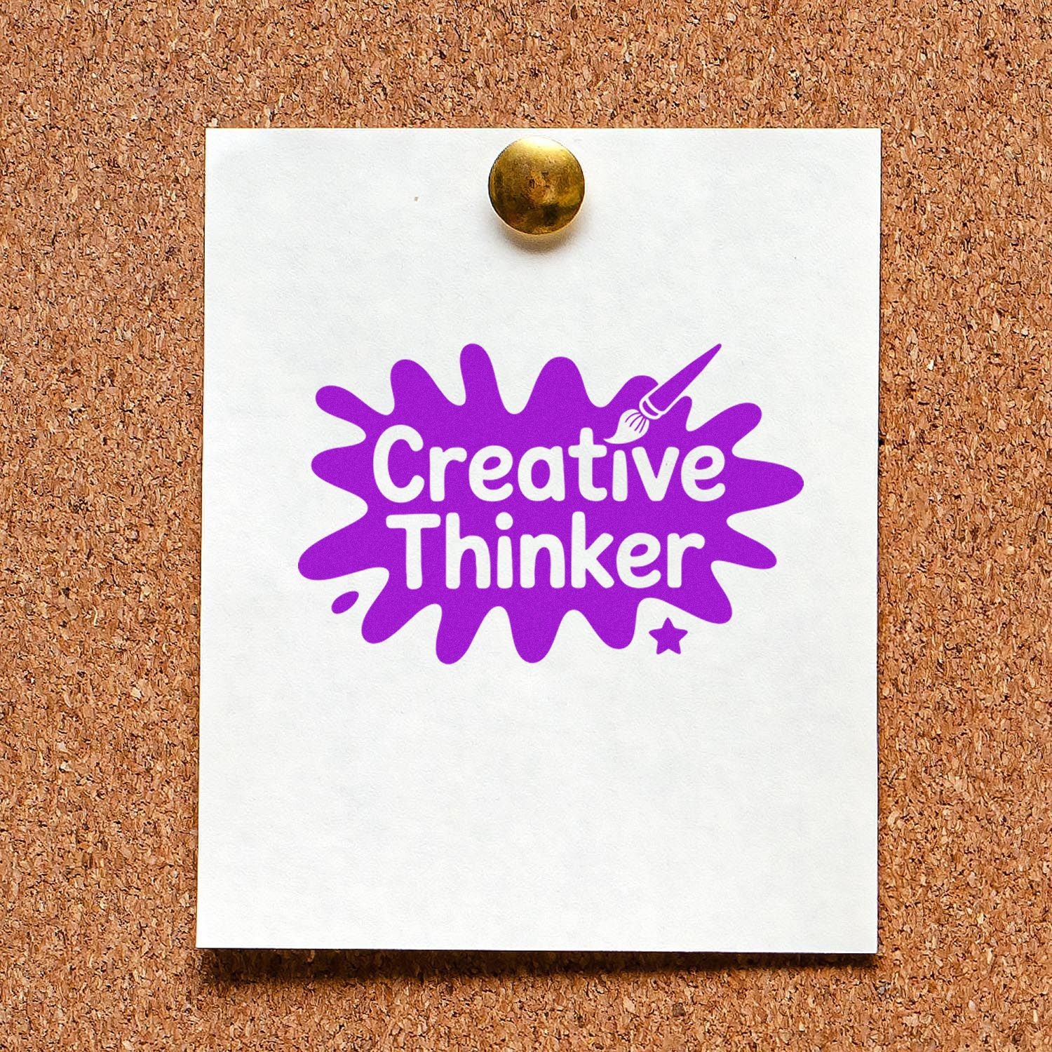 Purple Creative Thinker rubber stamp seal on white paper, pinned to corkboard with brass tack