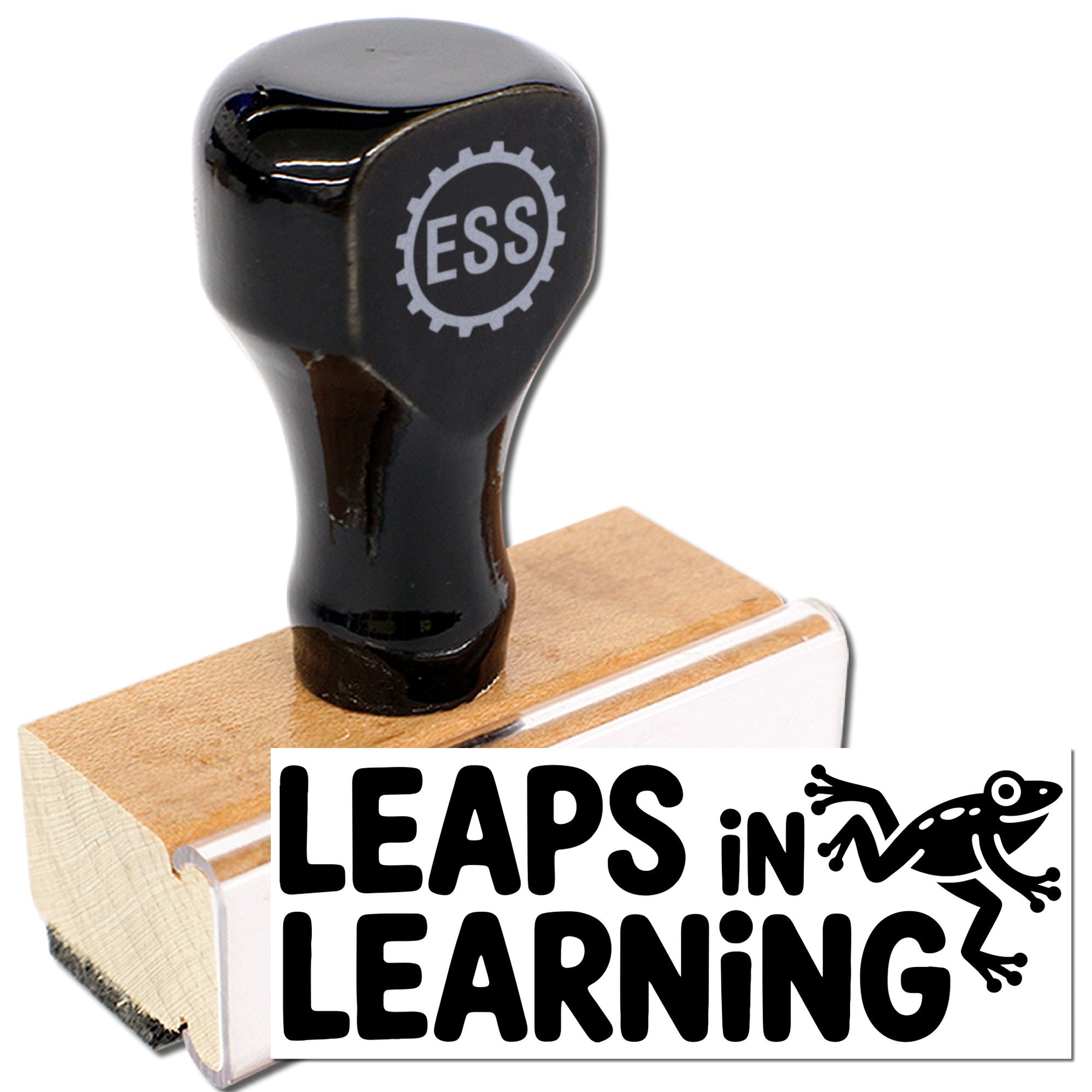 Black stamp and seal with ESS gear logo on wooden mount above LEAPS IN LEARNING text and frog graphic