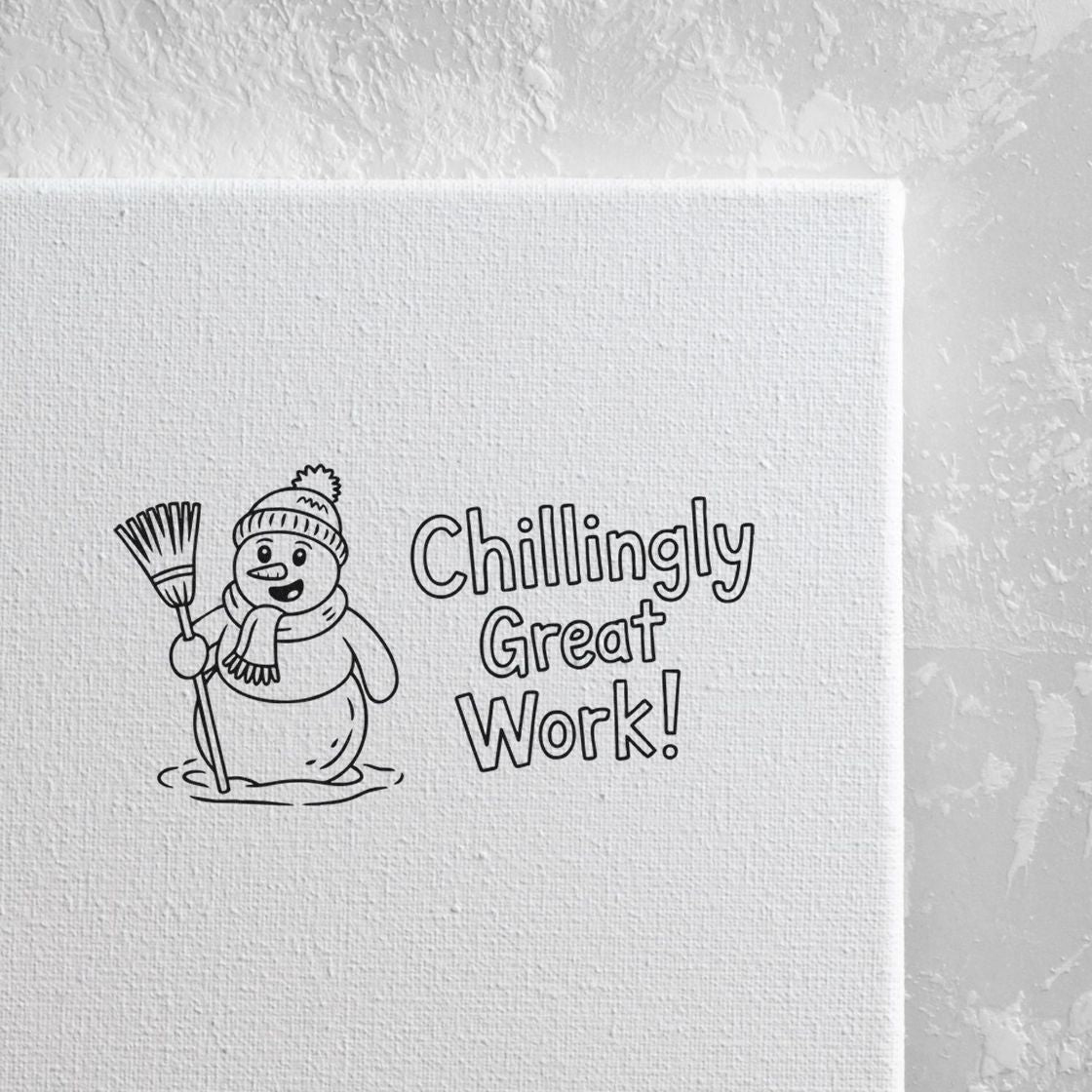 Black stamp and seal design with a smiling snowman, broom, and Chillingly Great Work! text on white canvas.