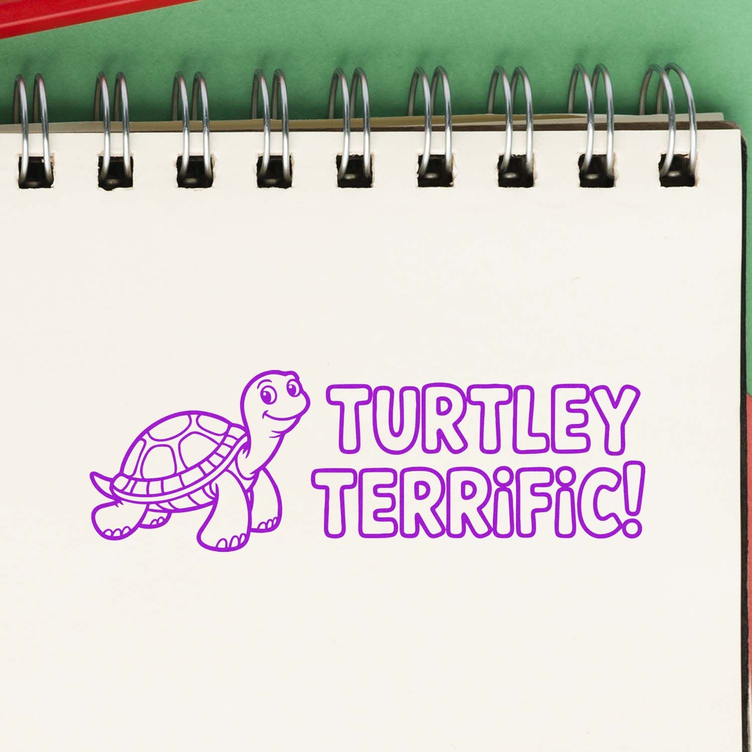 Purple turtle stamp and seal with TURTLEY TERRIFIC! on a spiral-bound notebook page.