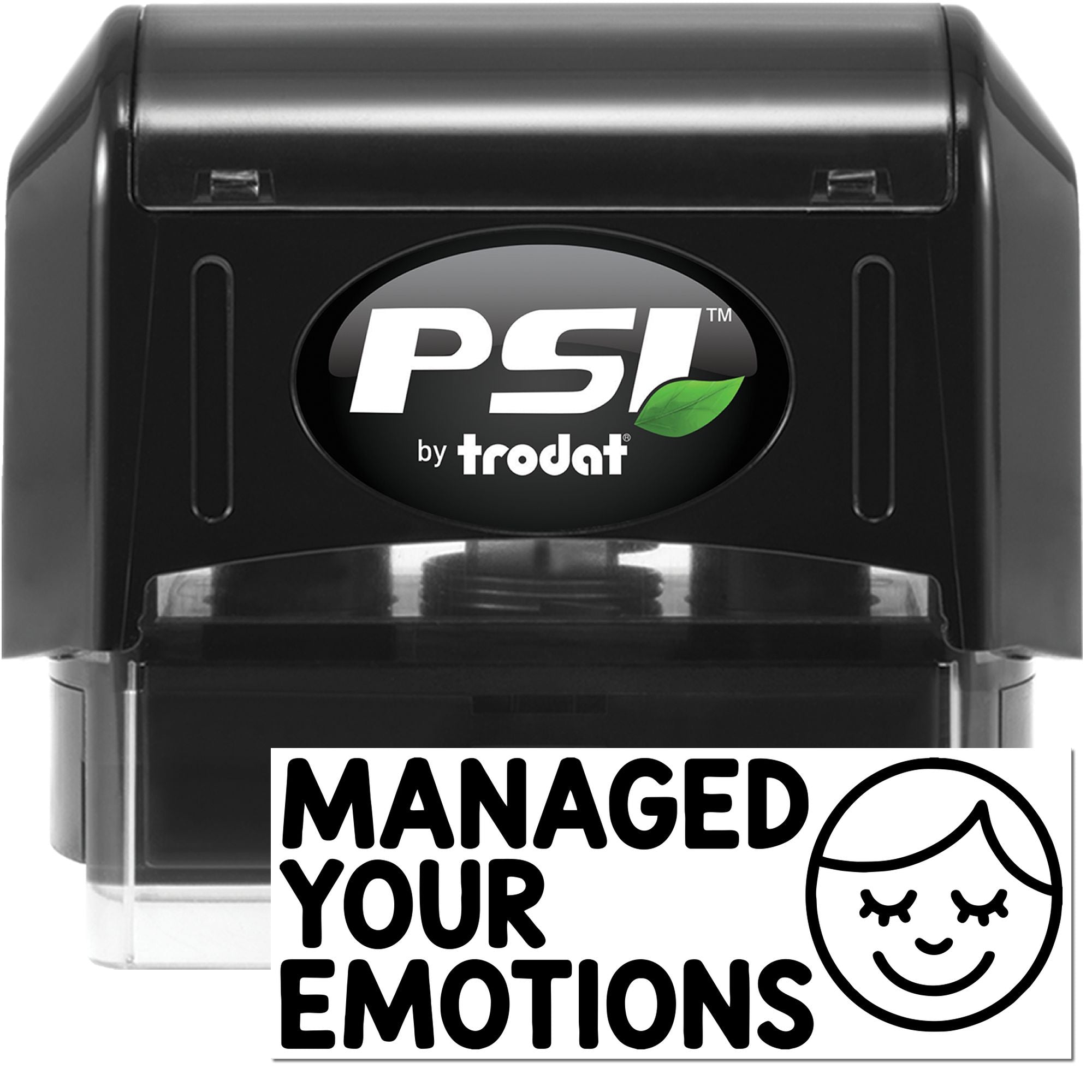 Black PSI by Trodat self-inking stamp with green leaf logo, clear base, and Managed Your Emotions seal with smiley face.