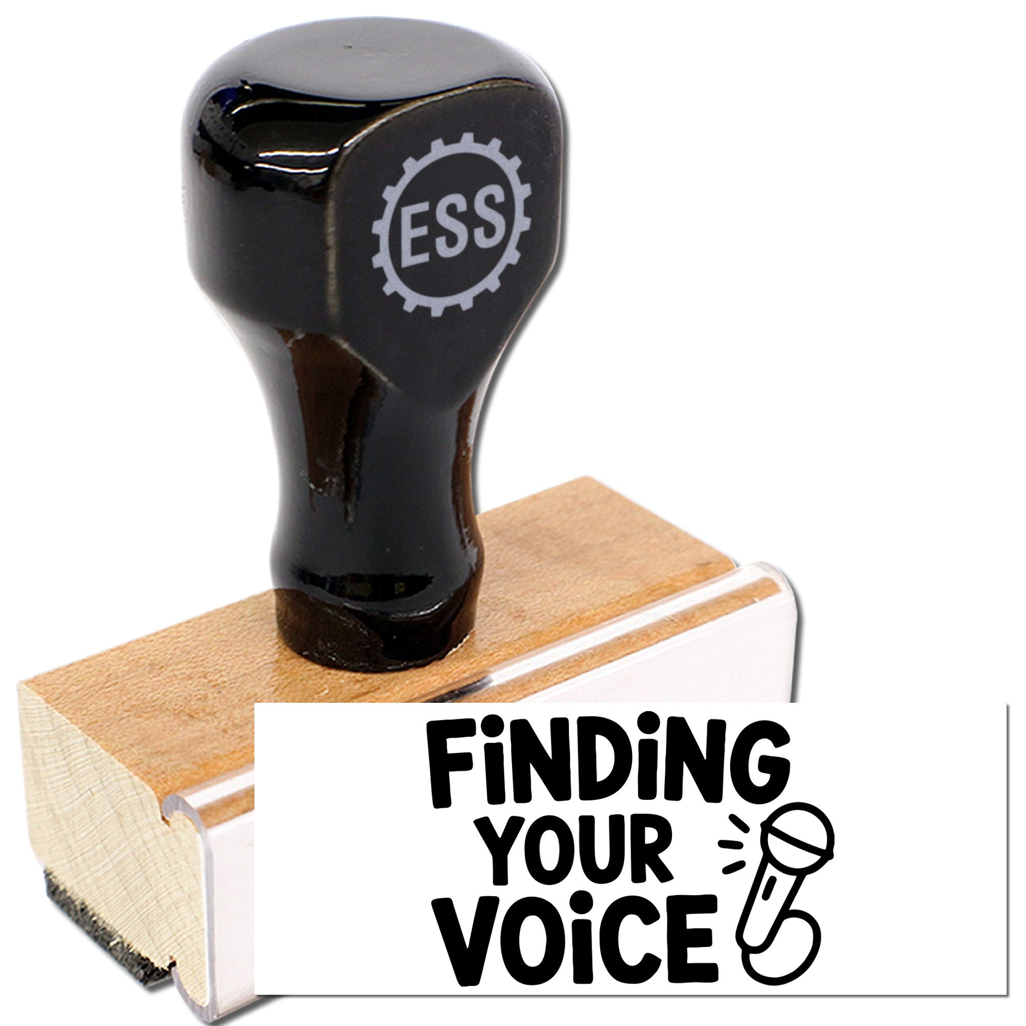 Black ESS rubber stamp on a wooden base, printing Finding Your Voice with a microphone icon on white.