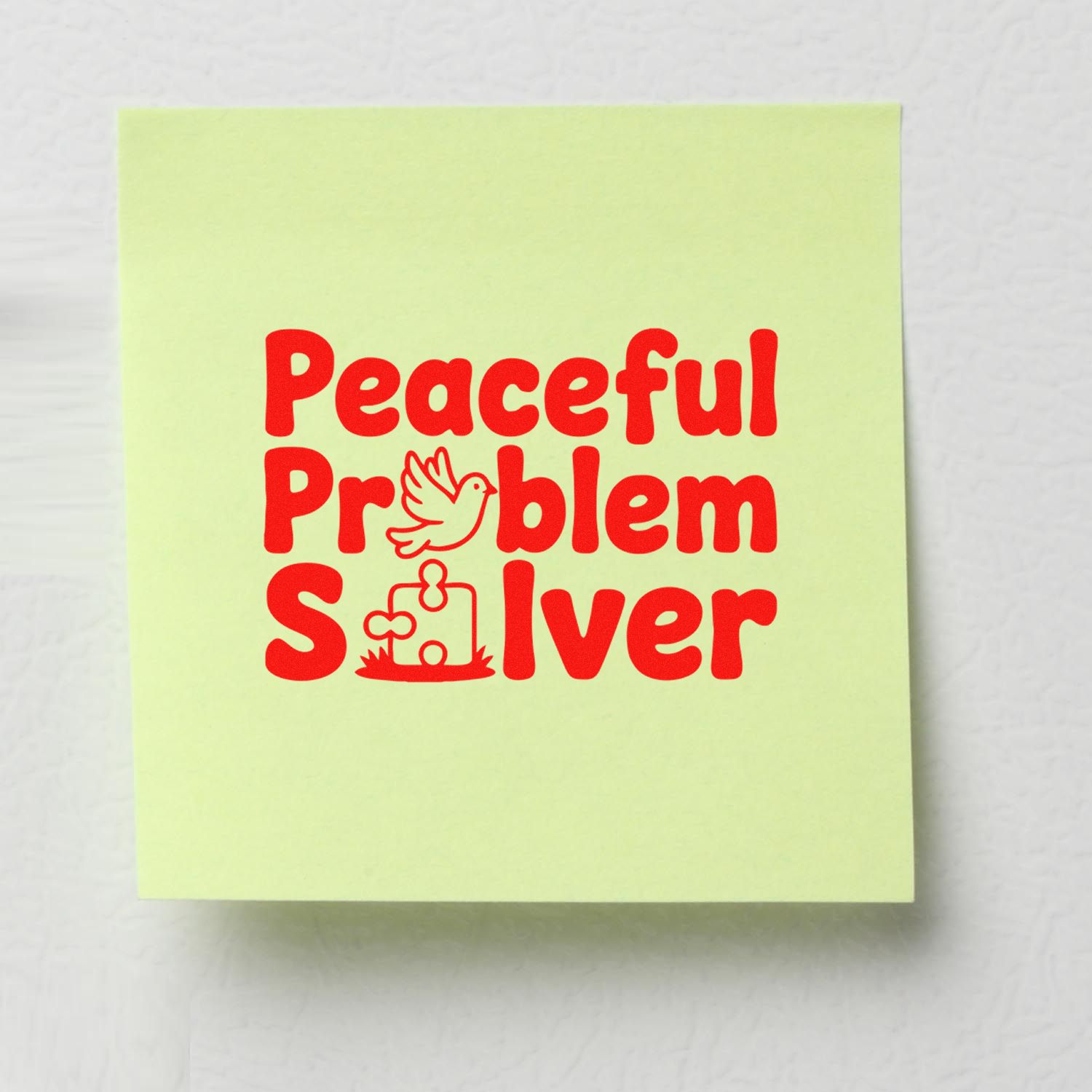 Pale yellow stamp pad with bold red Peaceful Problem Solver seal, featuring a dove and puzzle-piece stamp design.