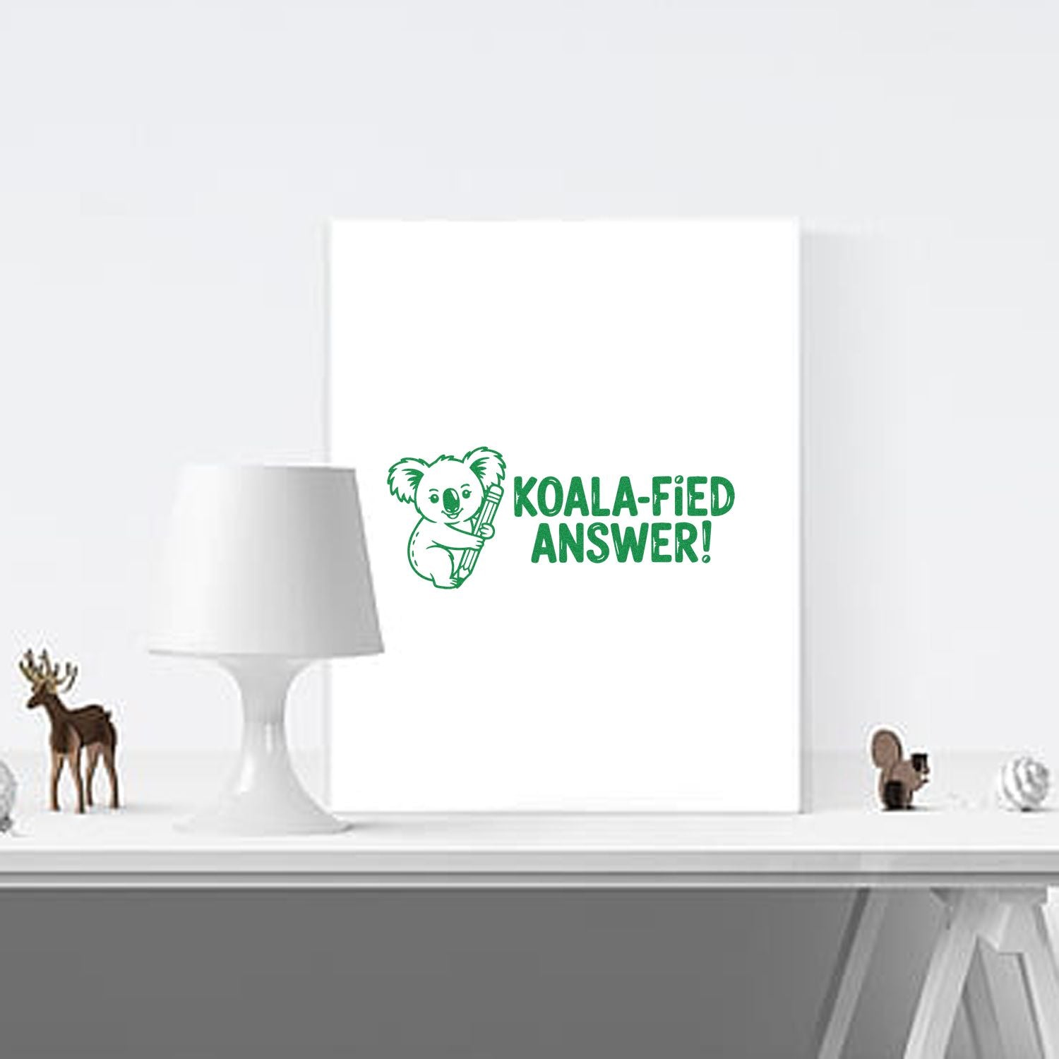 Green koala stamp with KOALA-FIED ANSWER! text on a white canvas, showcasing seal product design.