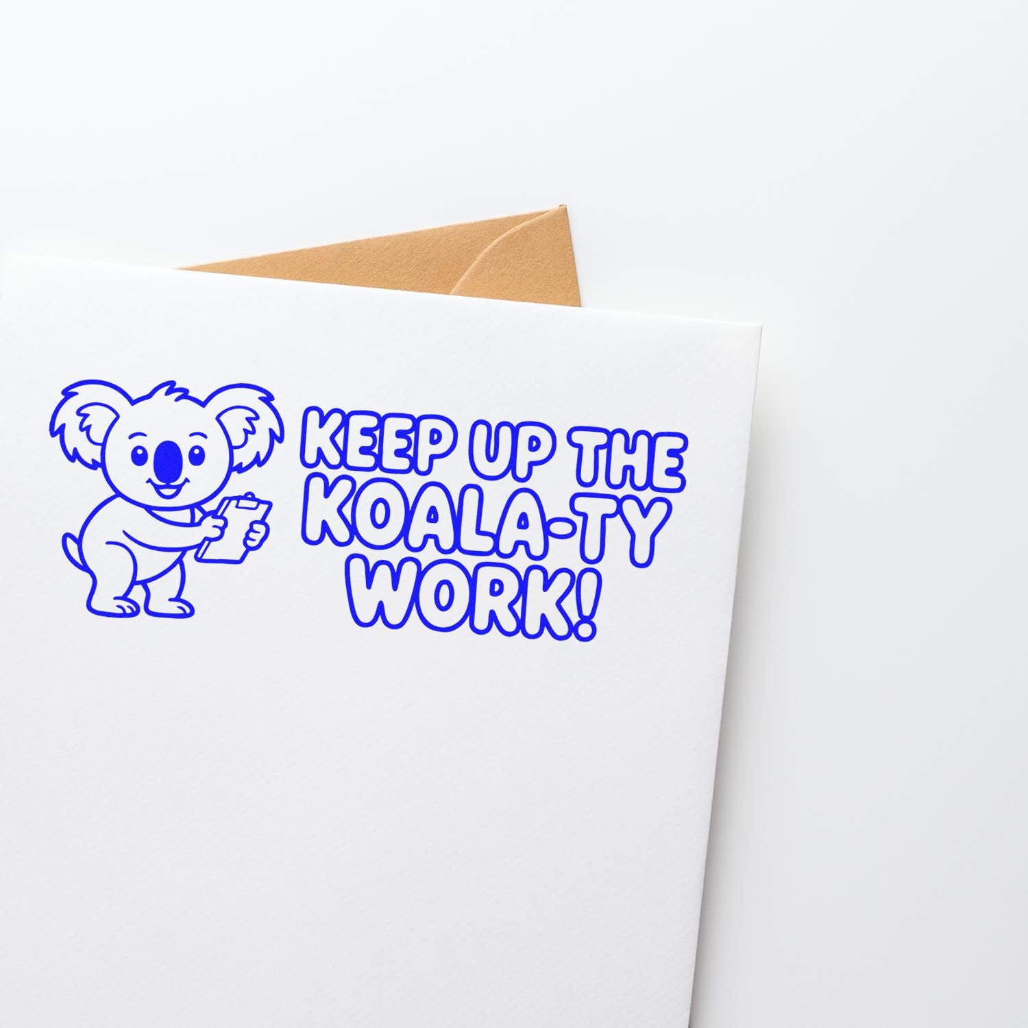 Blue koala stamp and seal design with KEEP UP THE KOALA-TY WORK! on a white envelope, brown envelope peeking behind.
