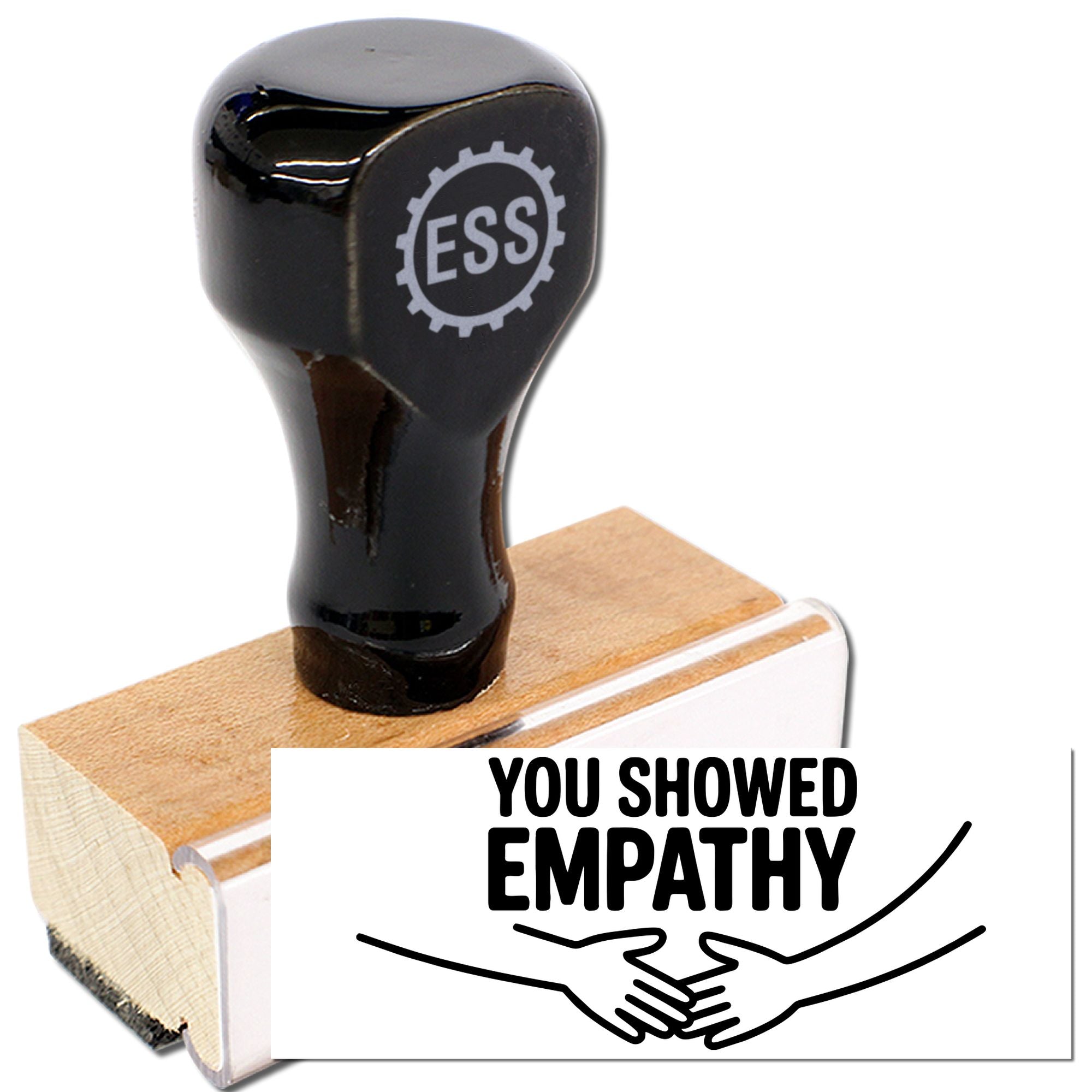 Black rubber empathy stamp with wooden handle, printing You showed empathy and handshake icon on white seal.