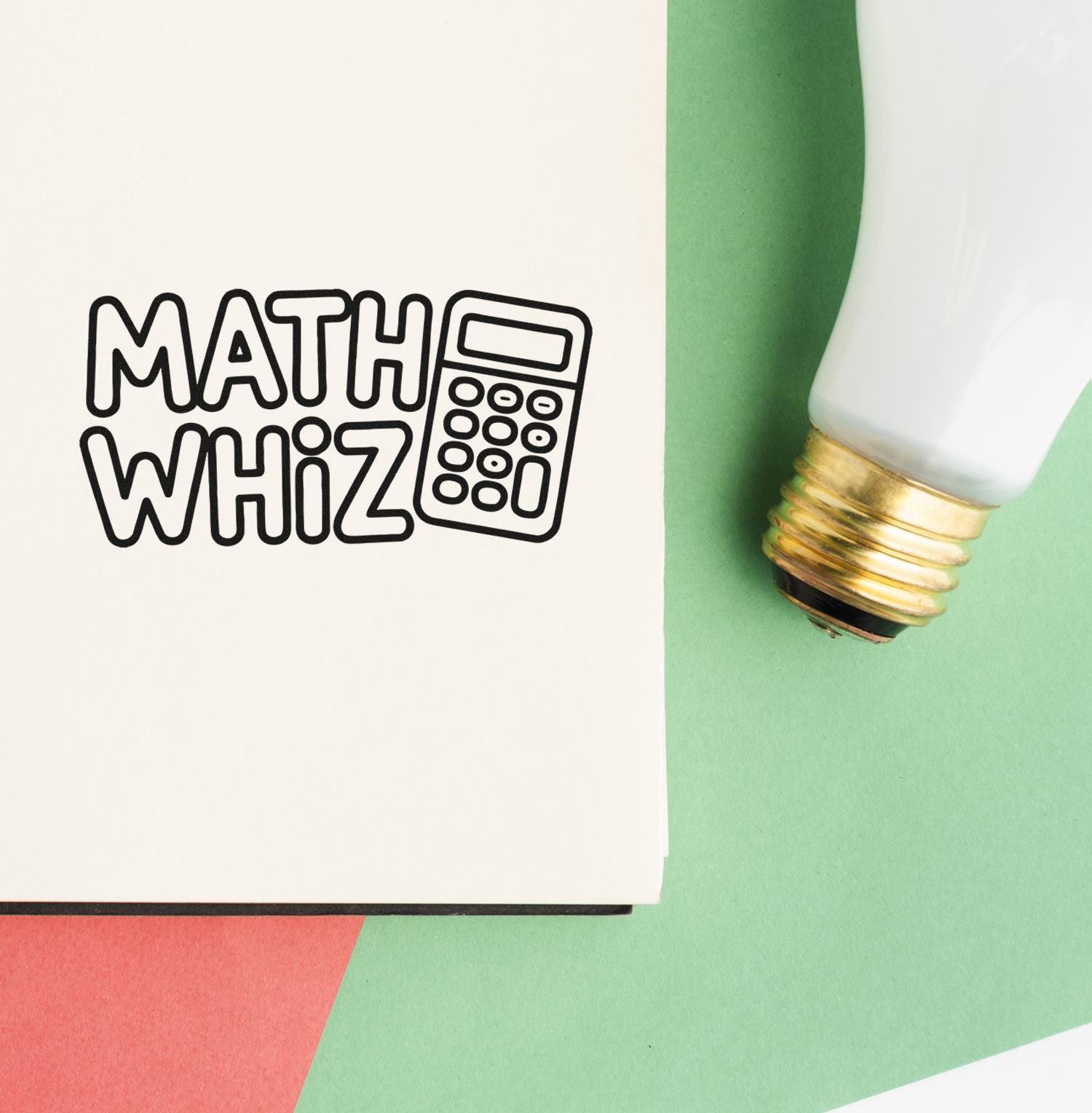 Black MATH WHIZ calculator stamp on white paper beside a white-and-gold seal bottle on a green background.